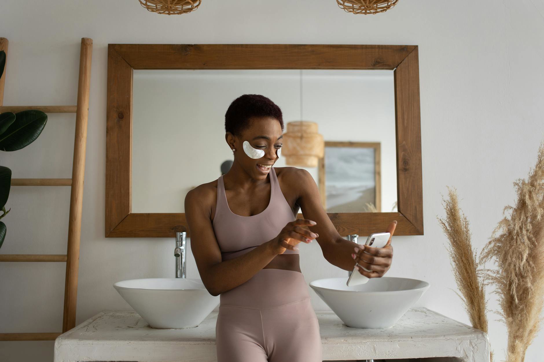 woman comparing skincare prices on phone in bathroom