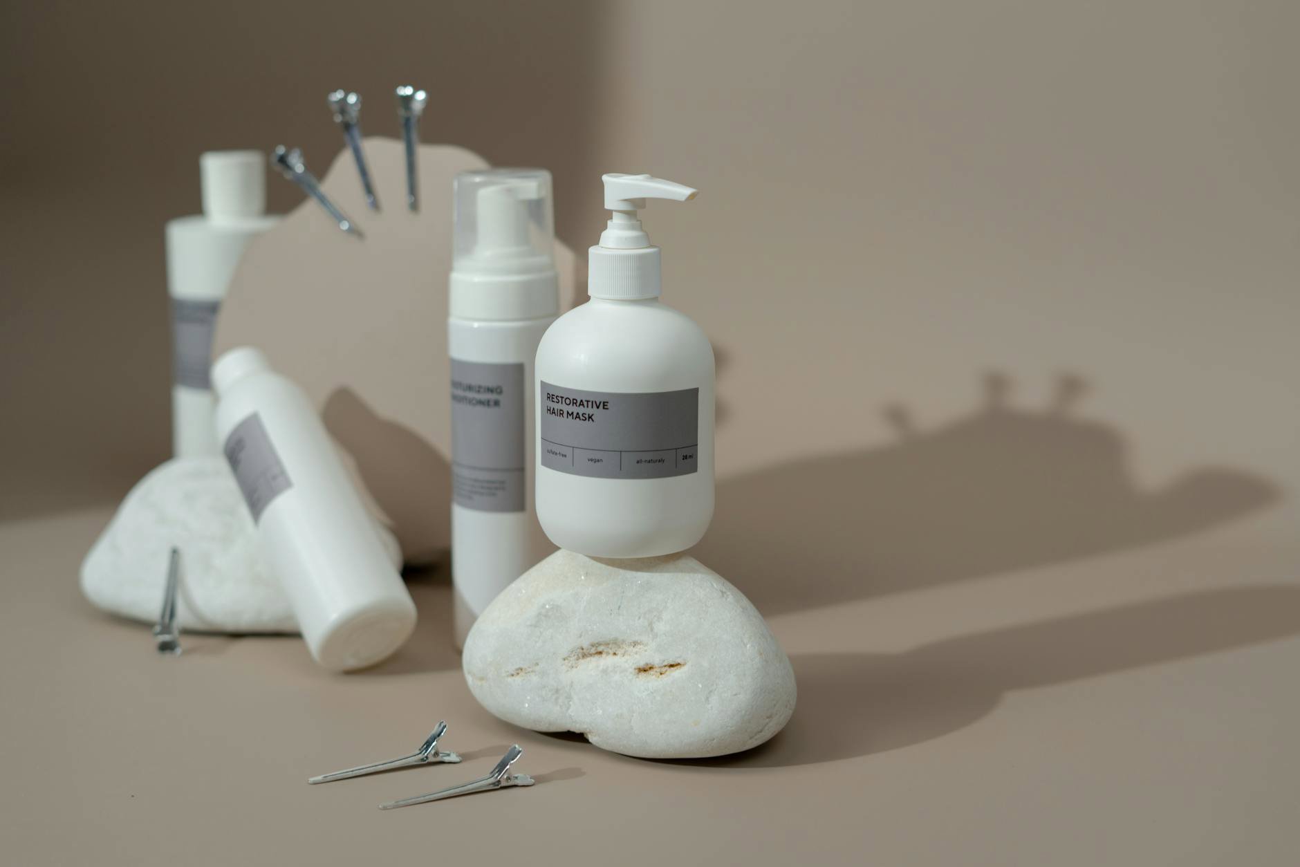 haircare products flatlay shampoo conditioner hair mask