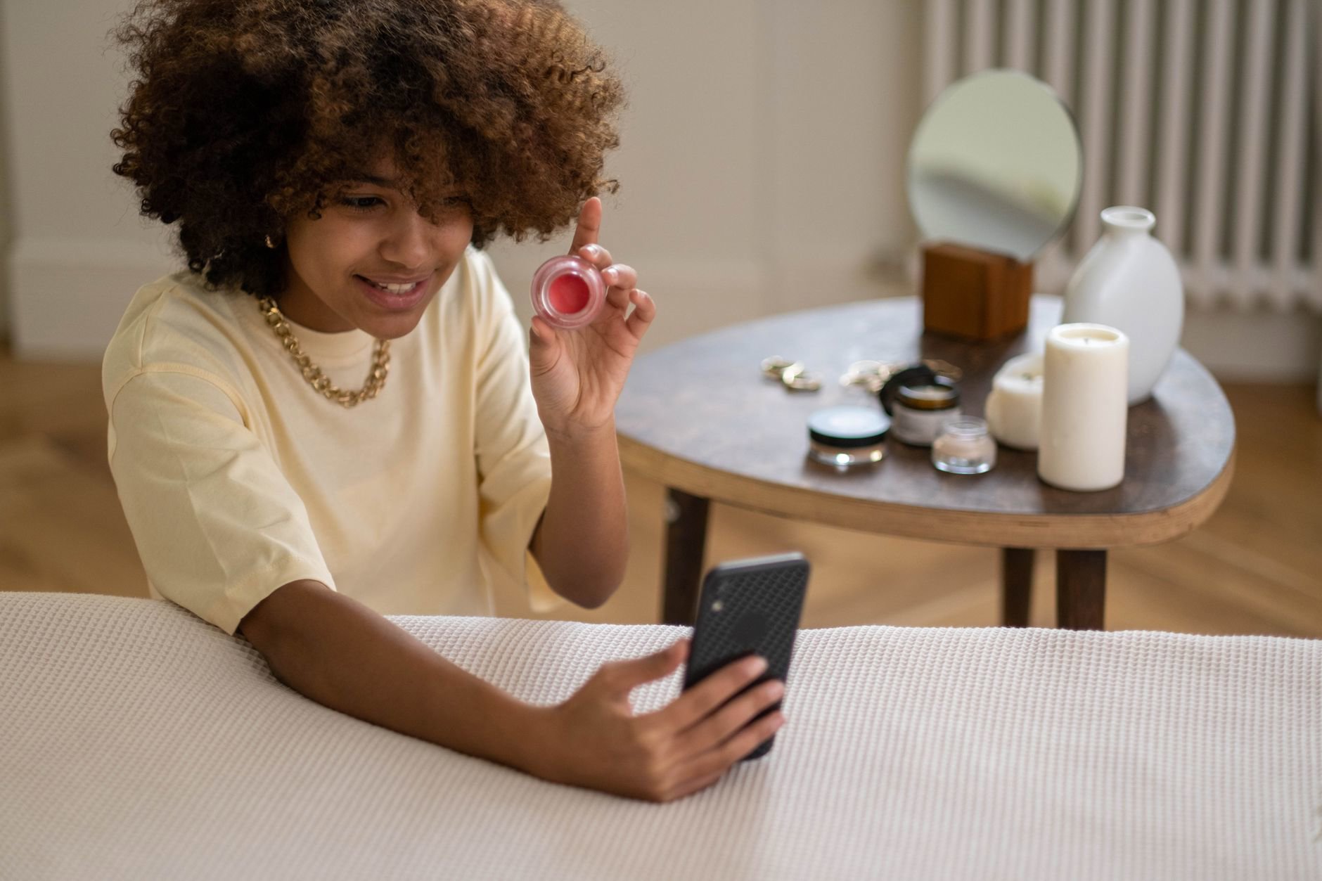 woman shopping beauty products on phone UK
