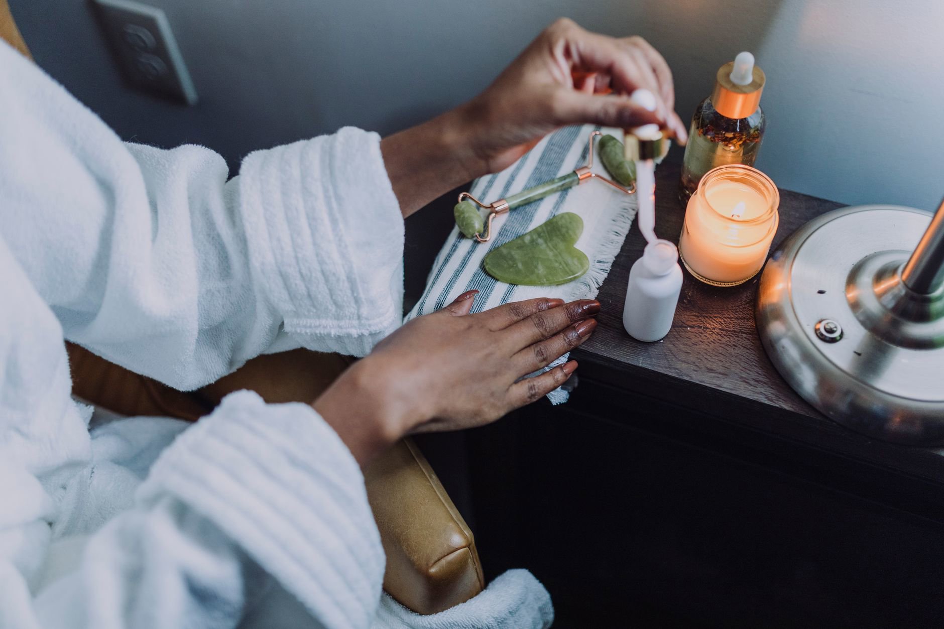 night skincare routine products on bedside table