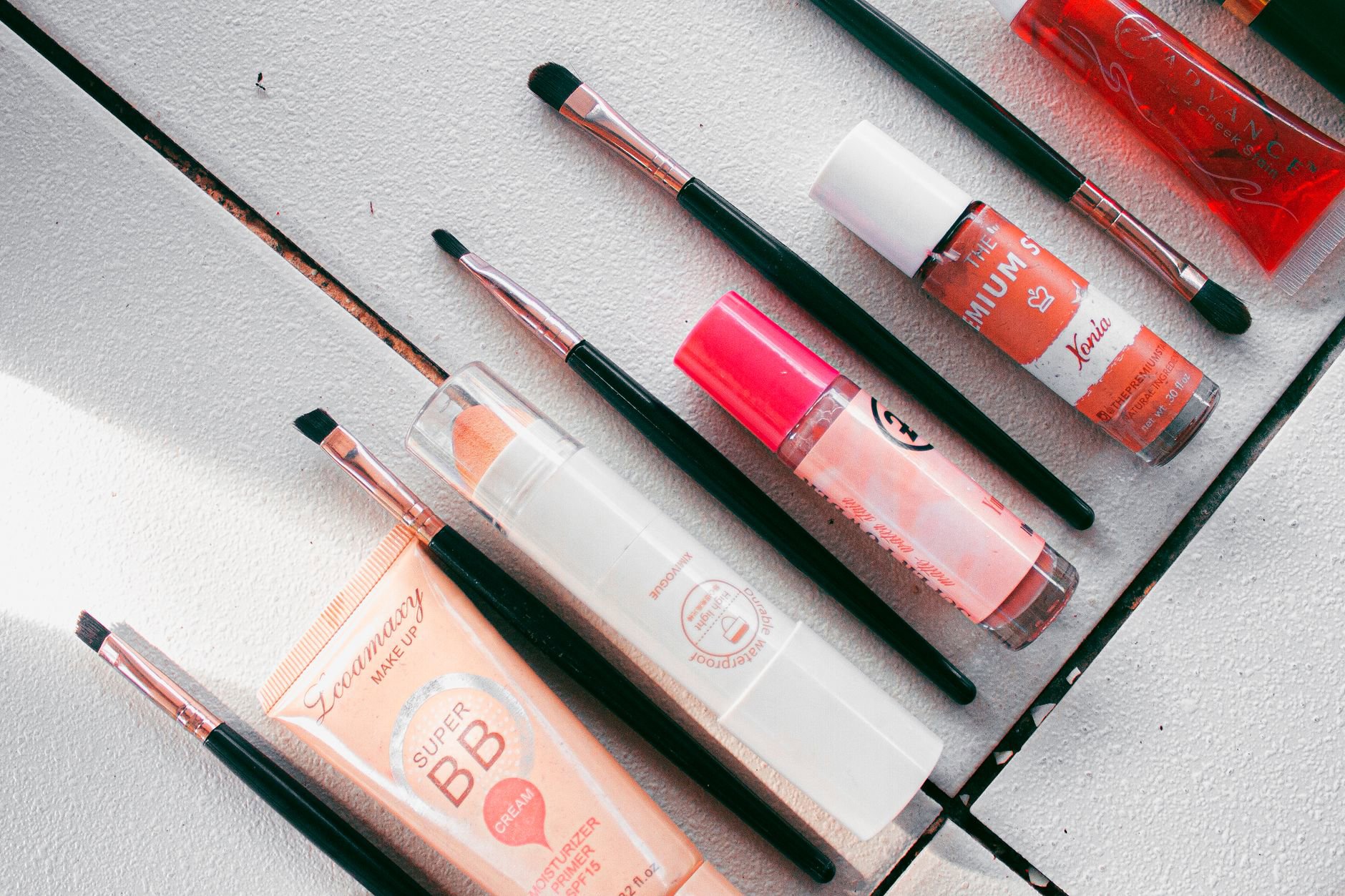 cosmetic products on vanity flatlay