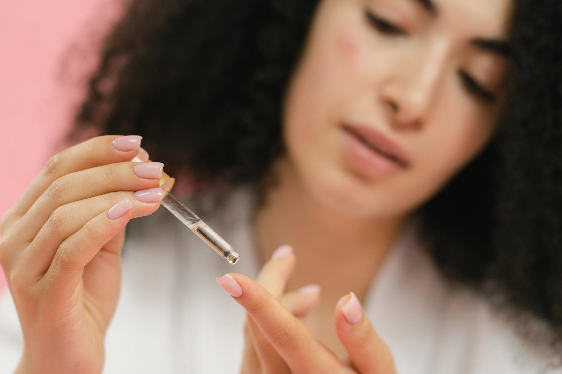 retinol serum texture on fingertip