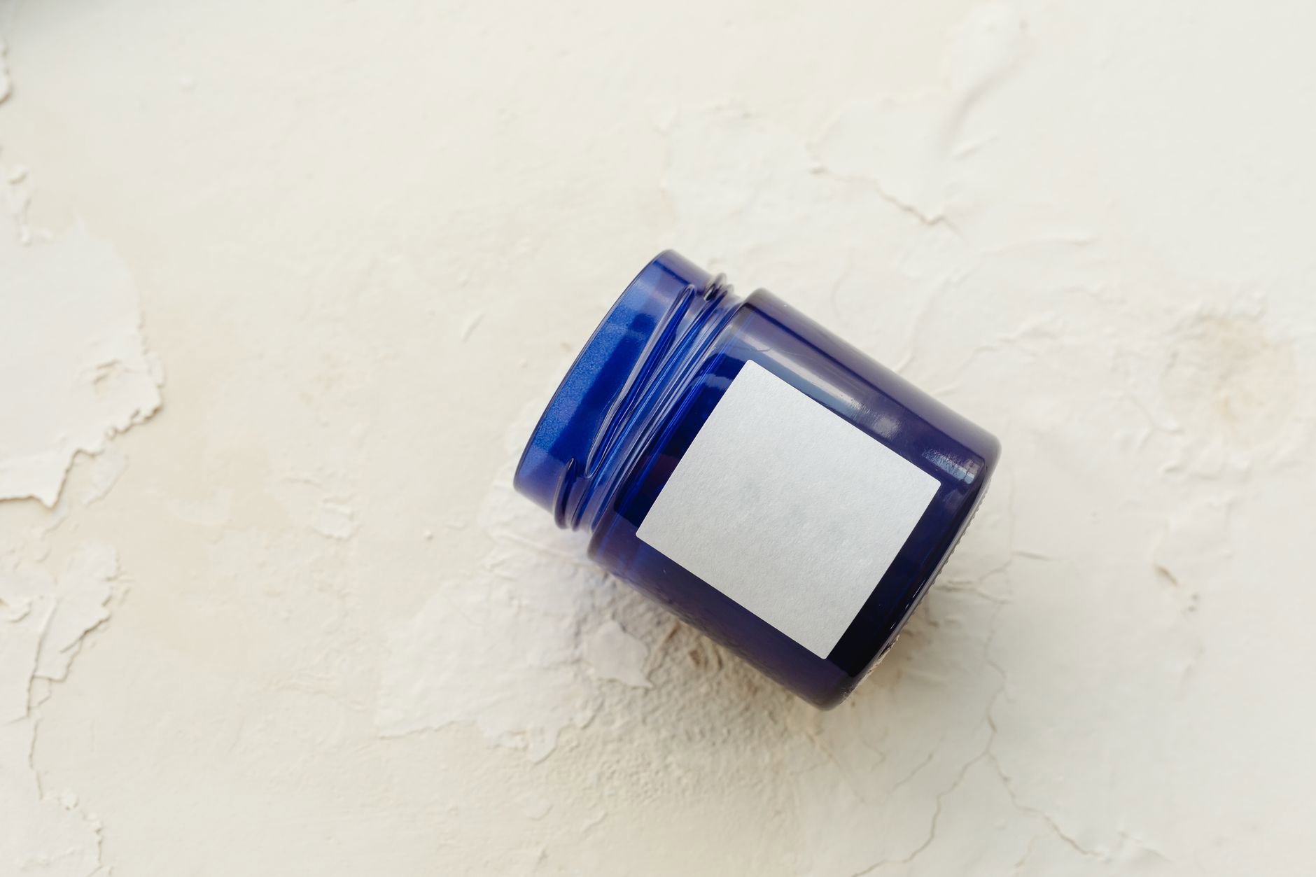 PAO open jar symbol skincare label closeup