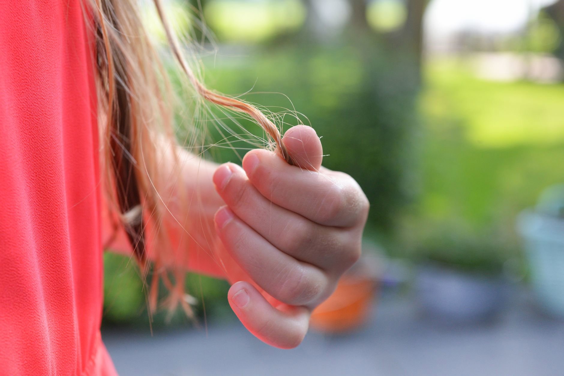close-up hair oil texture on fingertips