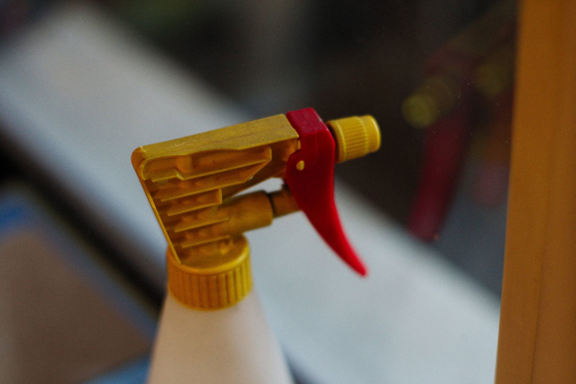 close up hairspray nozzle spraying mist
