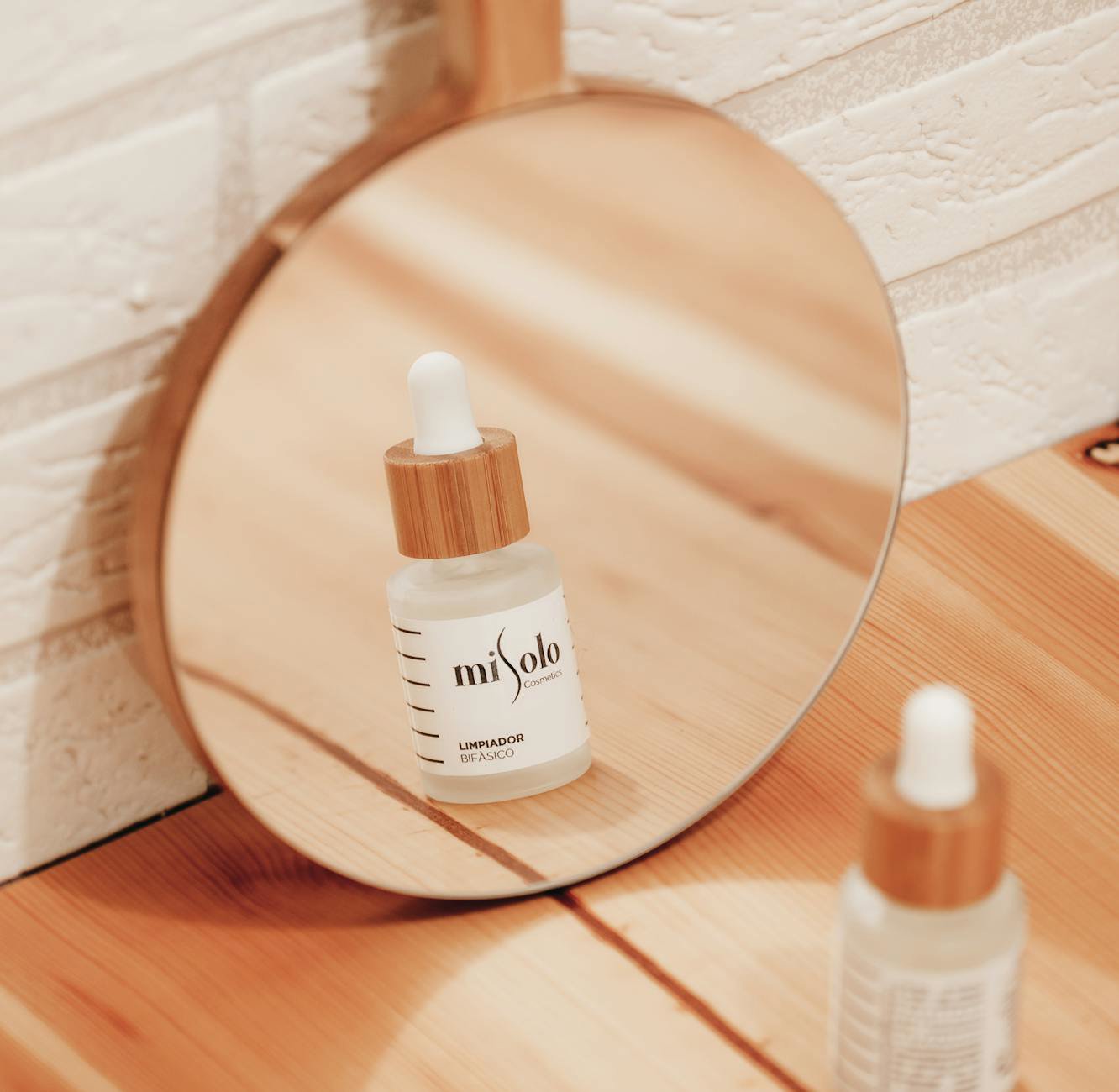 Vitamin C serum bottle on bathroom vanity morning light
