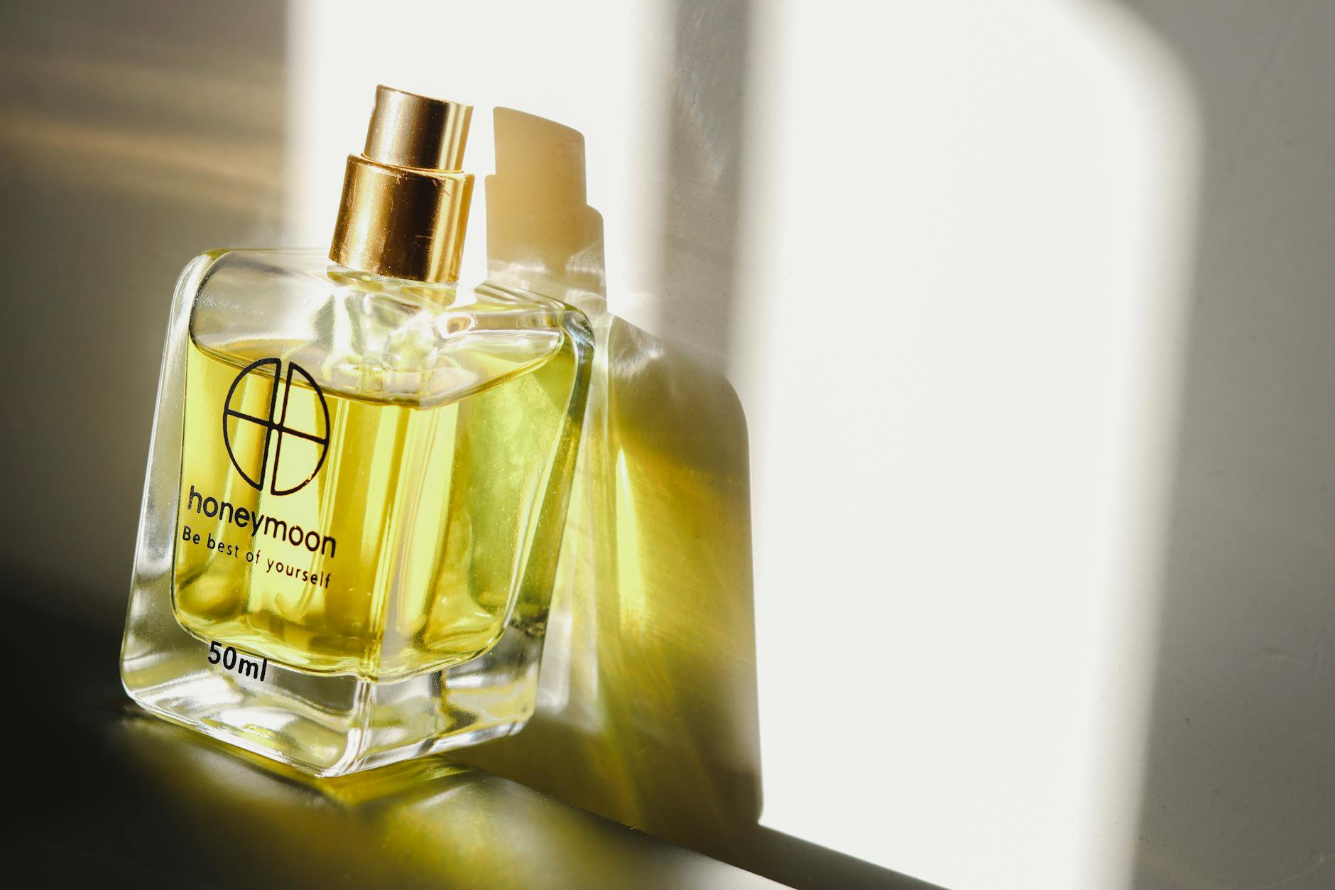 perfume bottle on wooden vanity sunlight