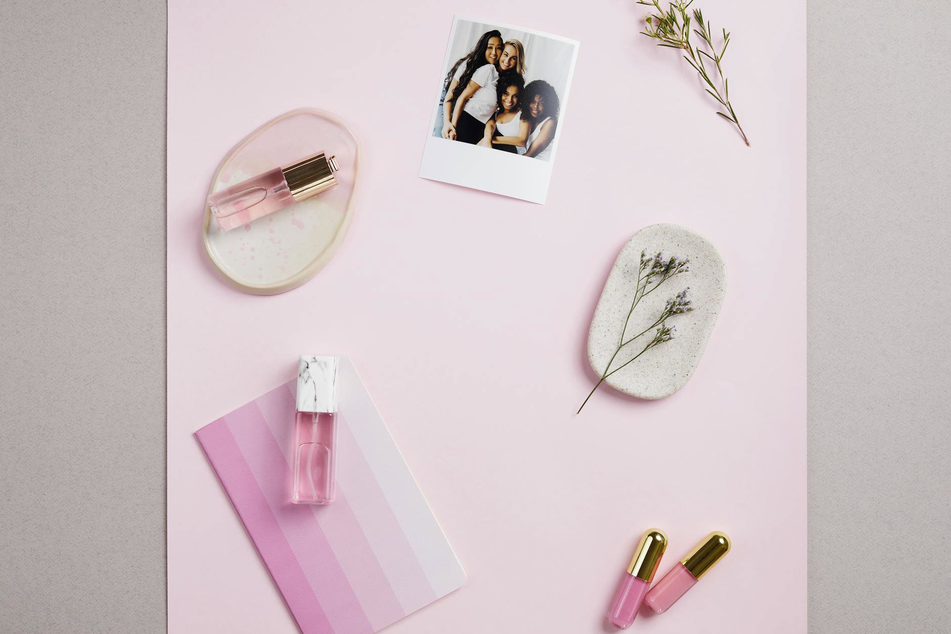 scarf and perfume flatlay minimal