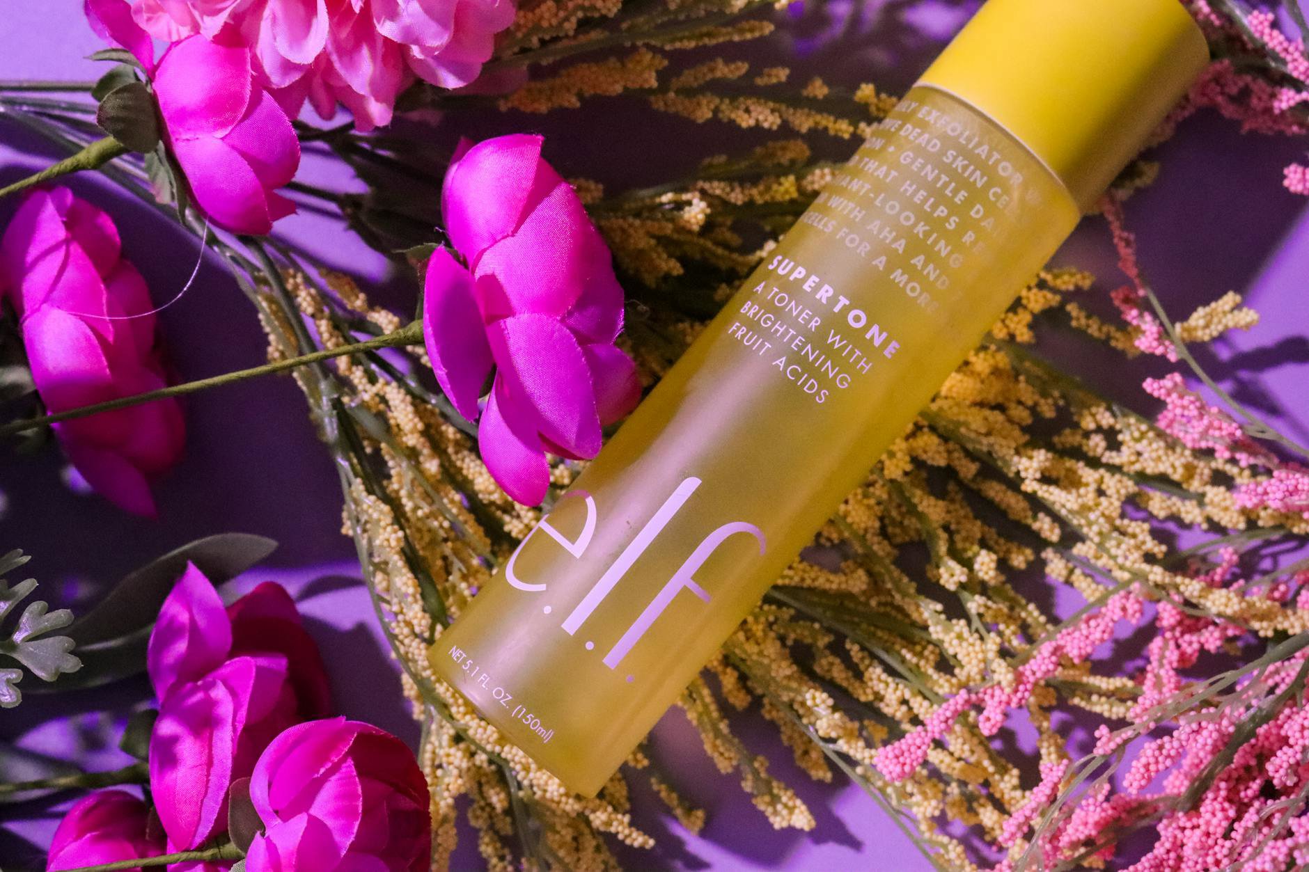 exfoliating toner bottle flatlay