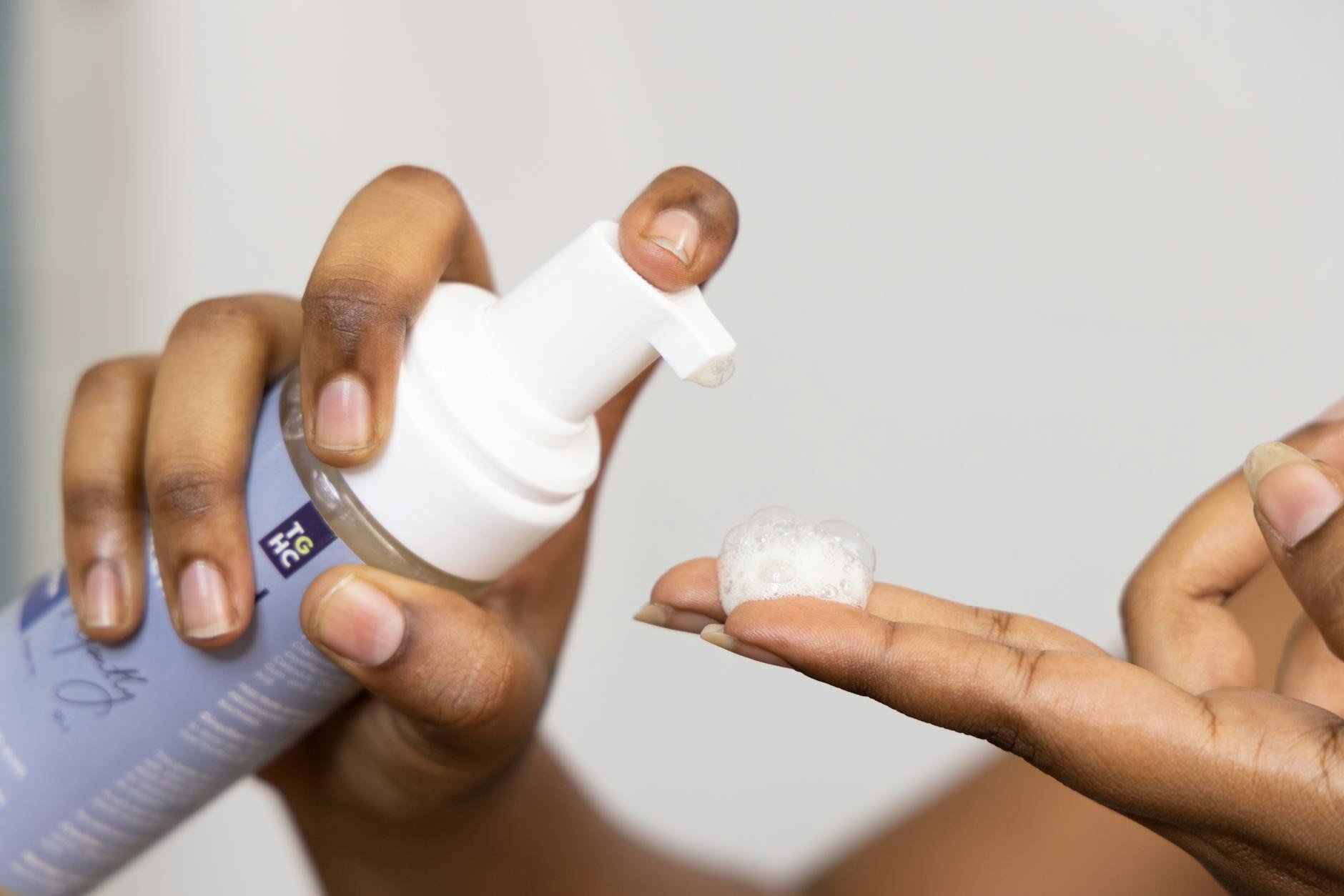 foaming facial cleanser texture in hands