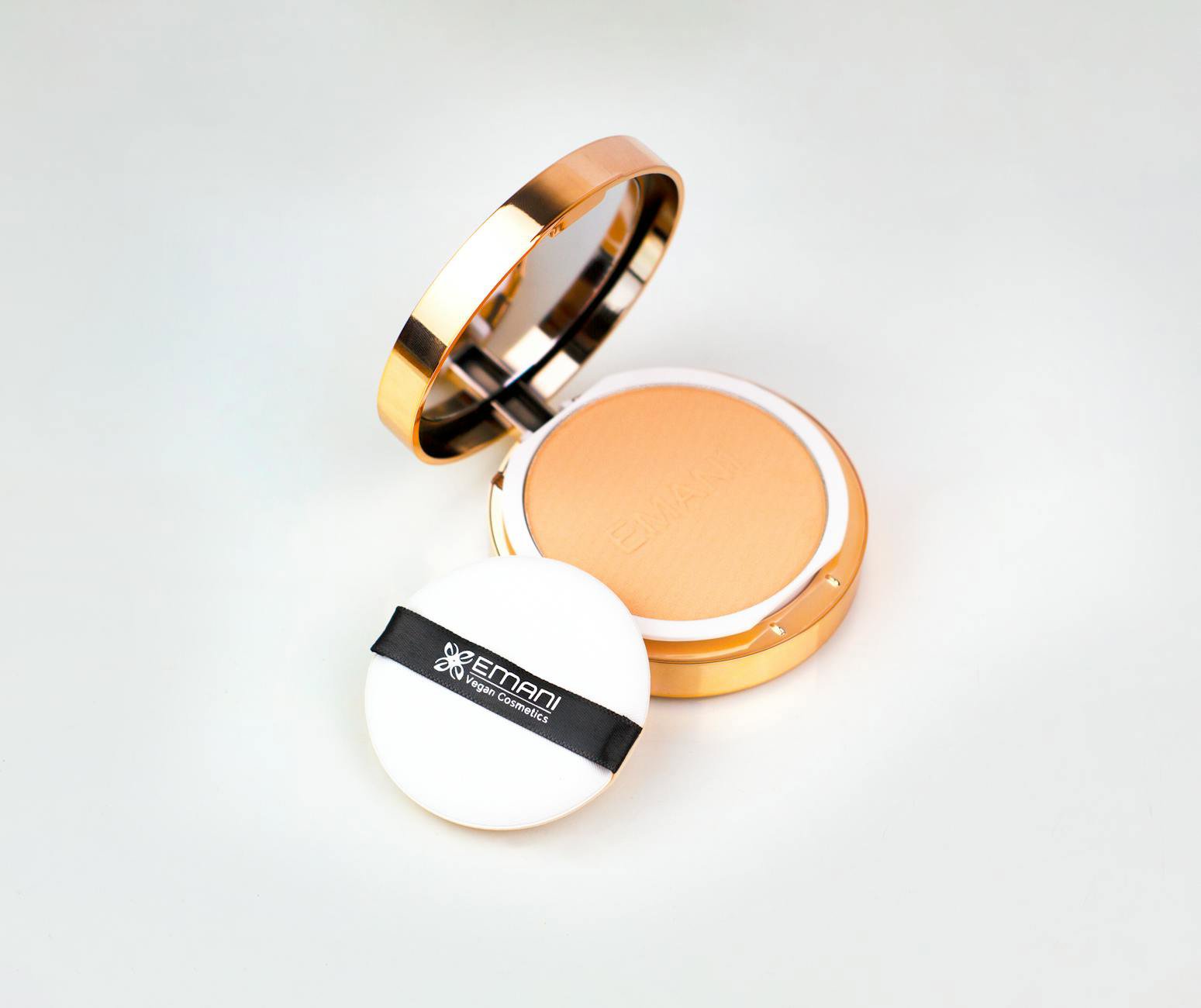 powder compact and makeup puff close up