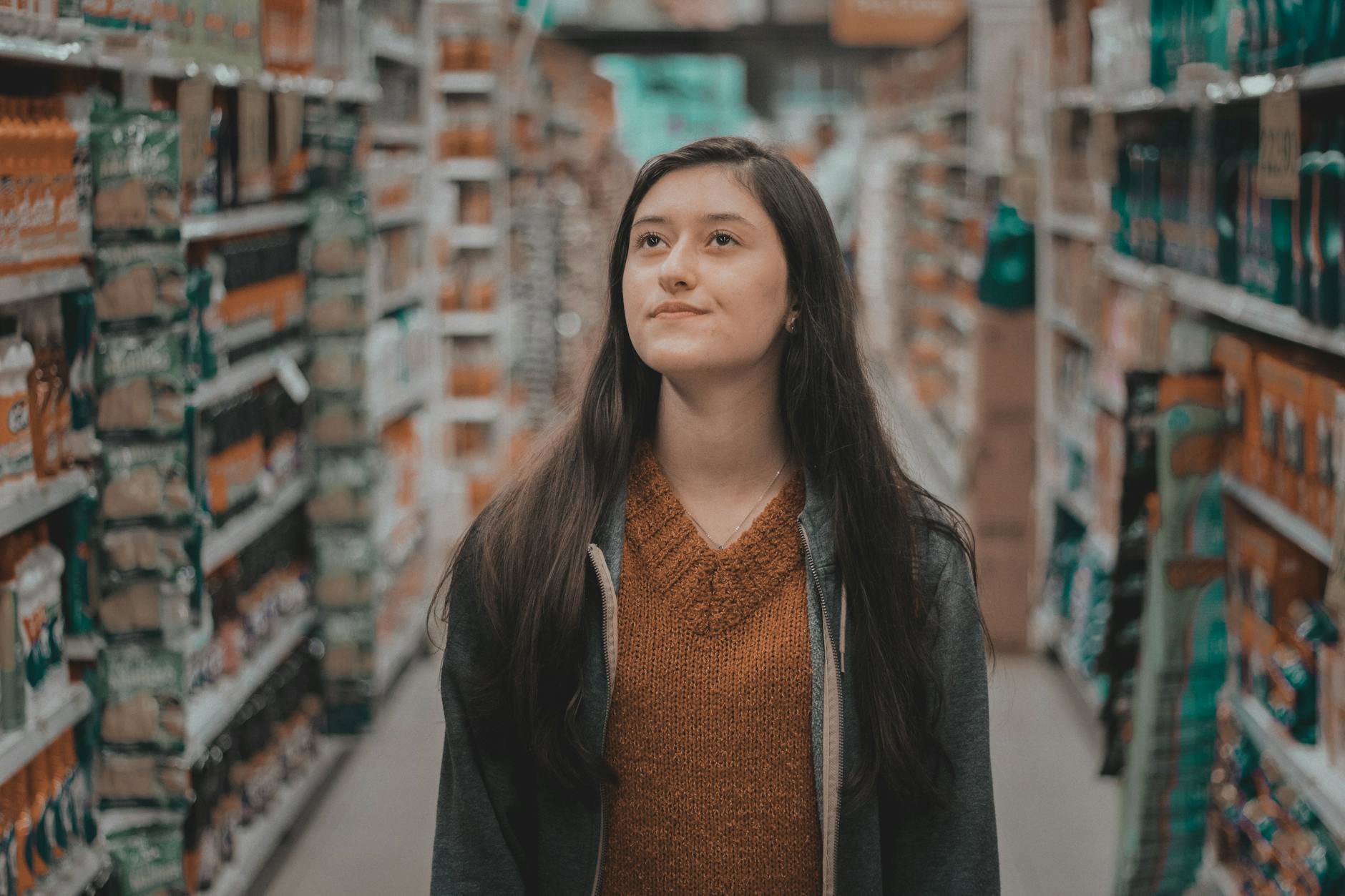 woman shopping beauty aisle Boots Ireland