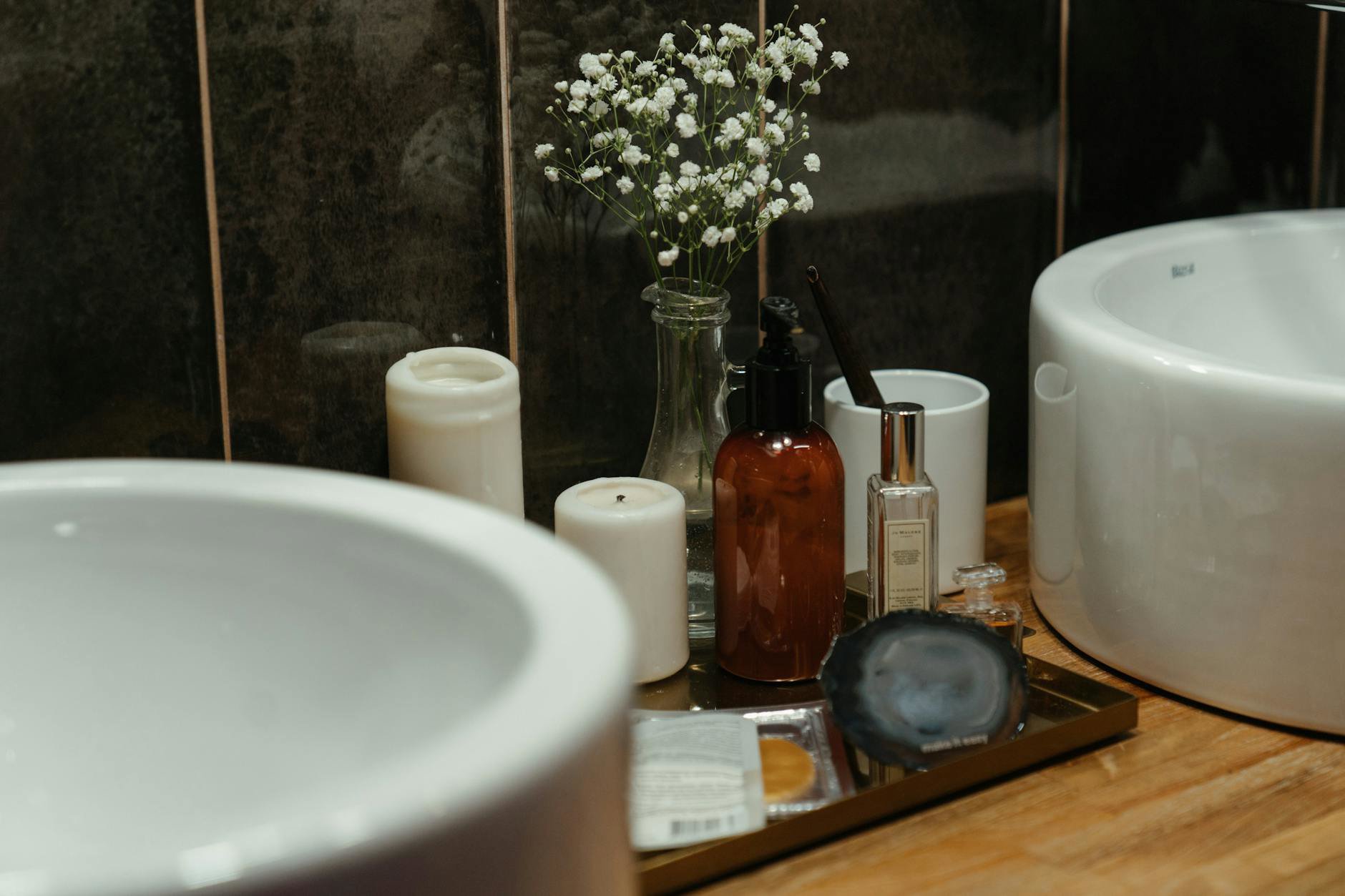perfume bottle on bathroom counter with sunscreen