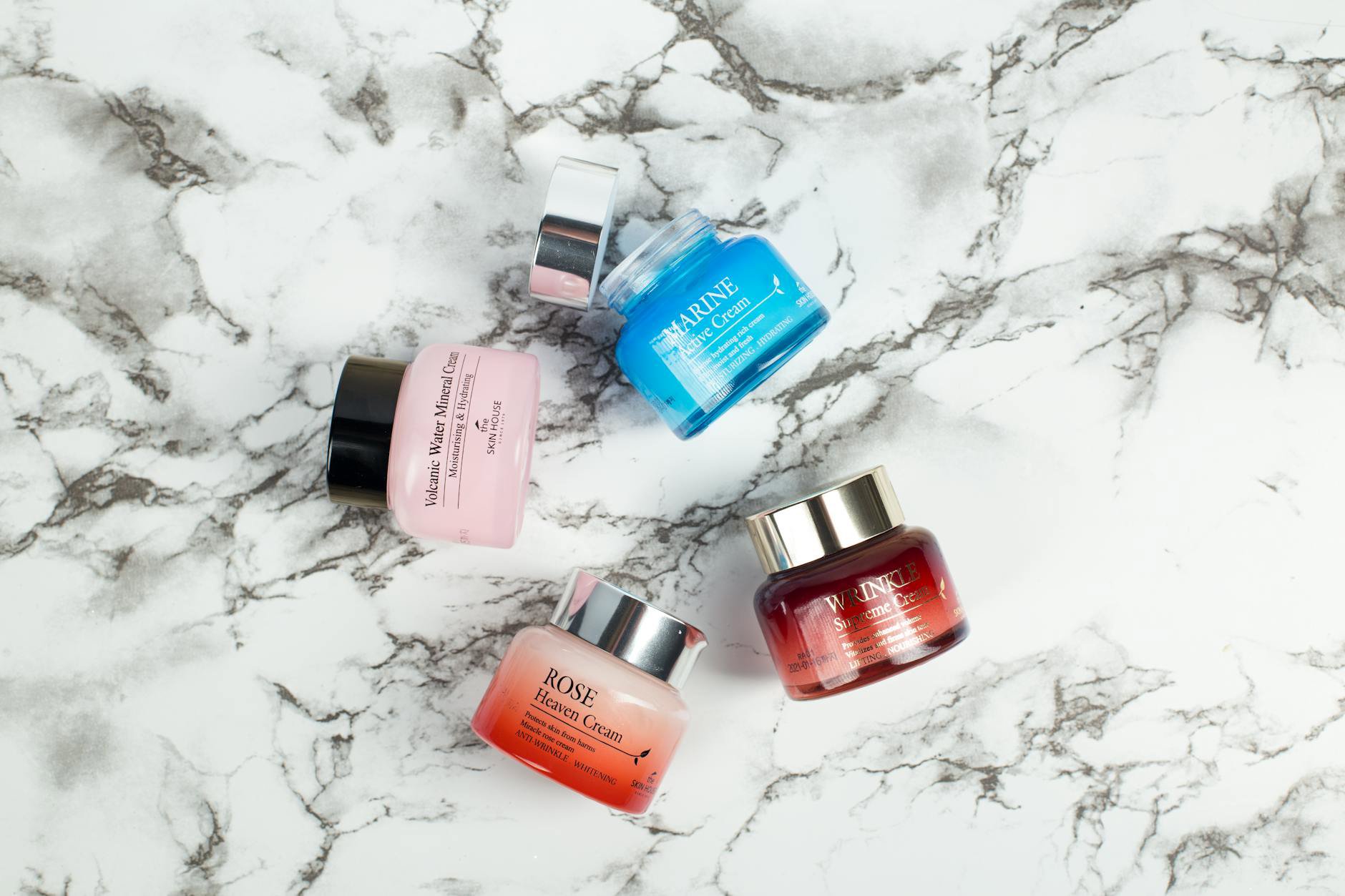 skincare products flatlay eye cream jars