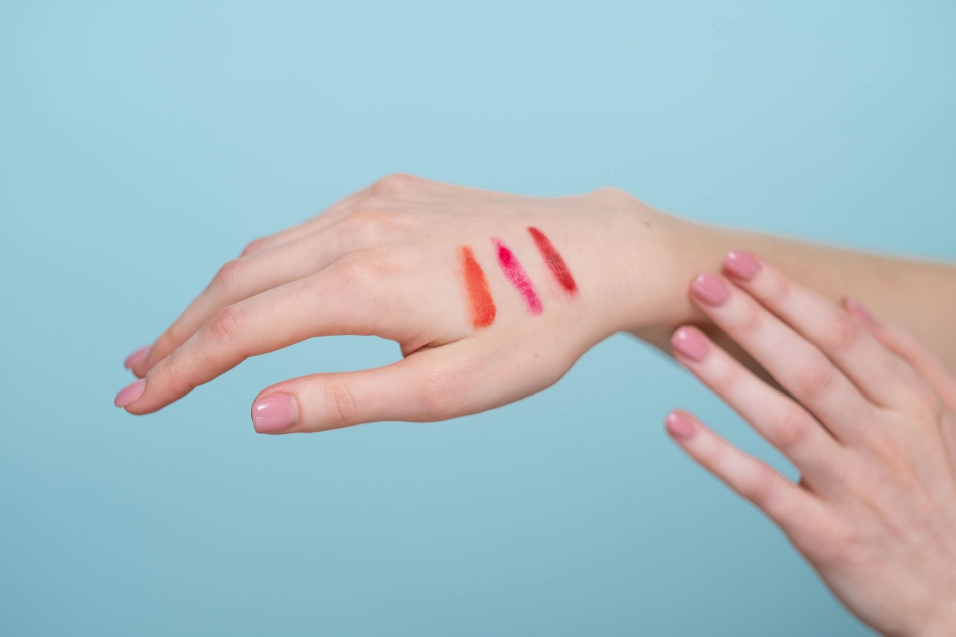 concealer swatches on cheek with redness