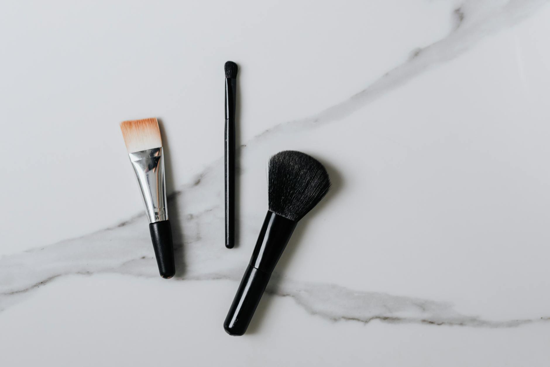 foundation brush types flat buffing angled on vanity