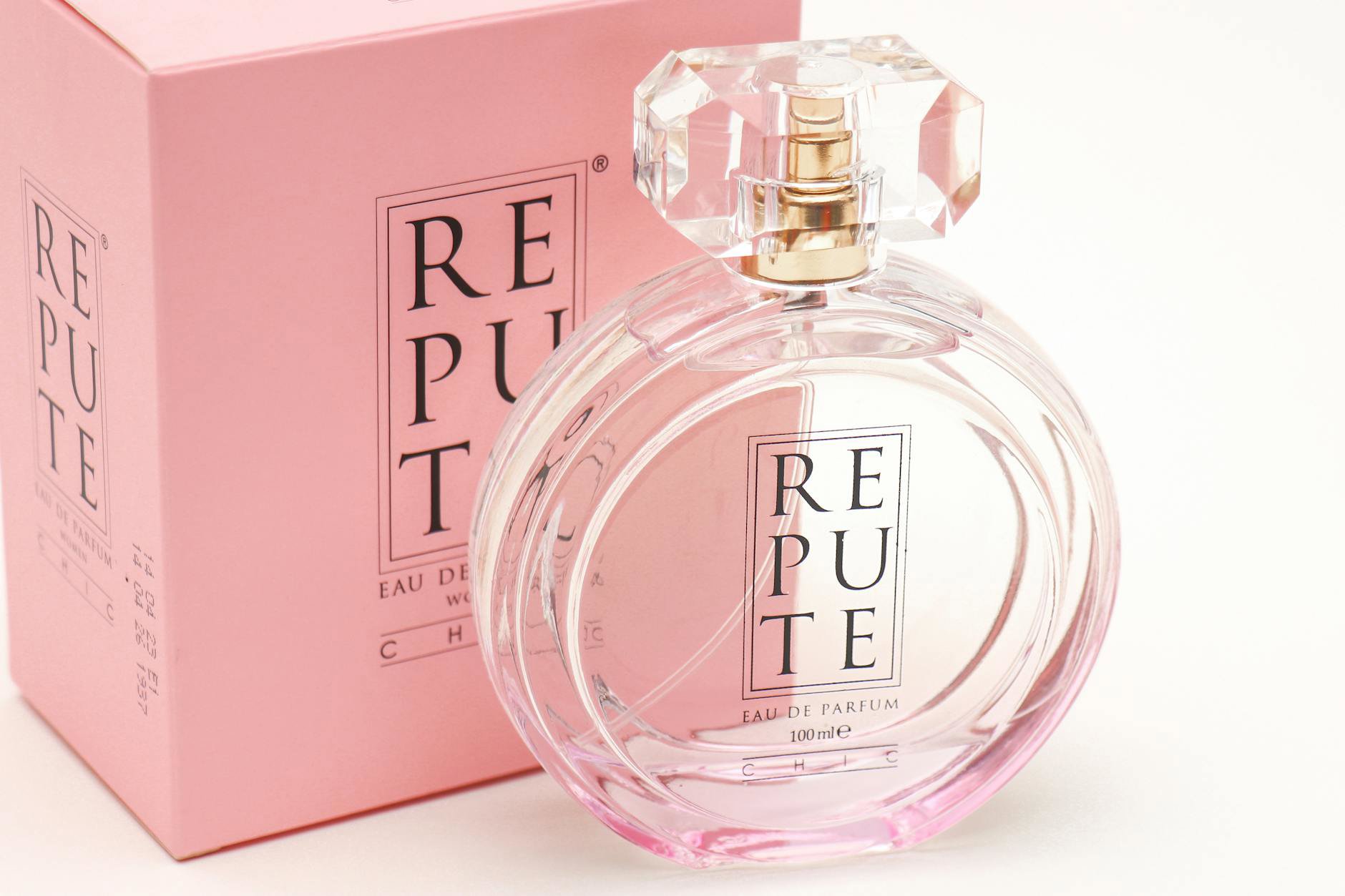 perfume layering on vanity with bottles