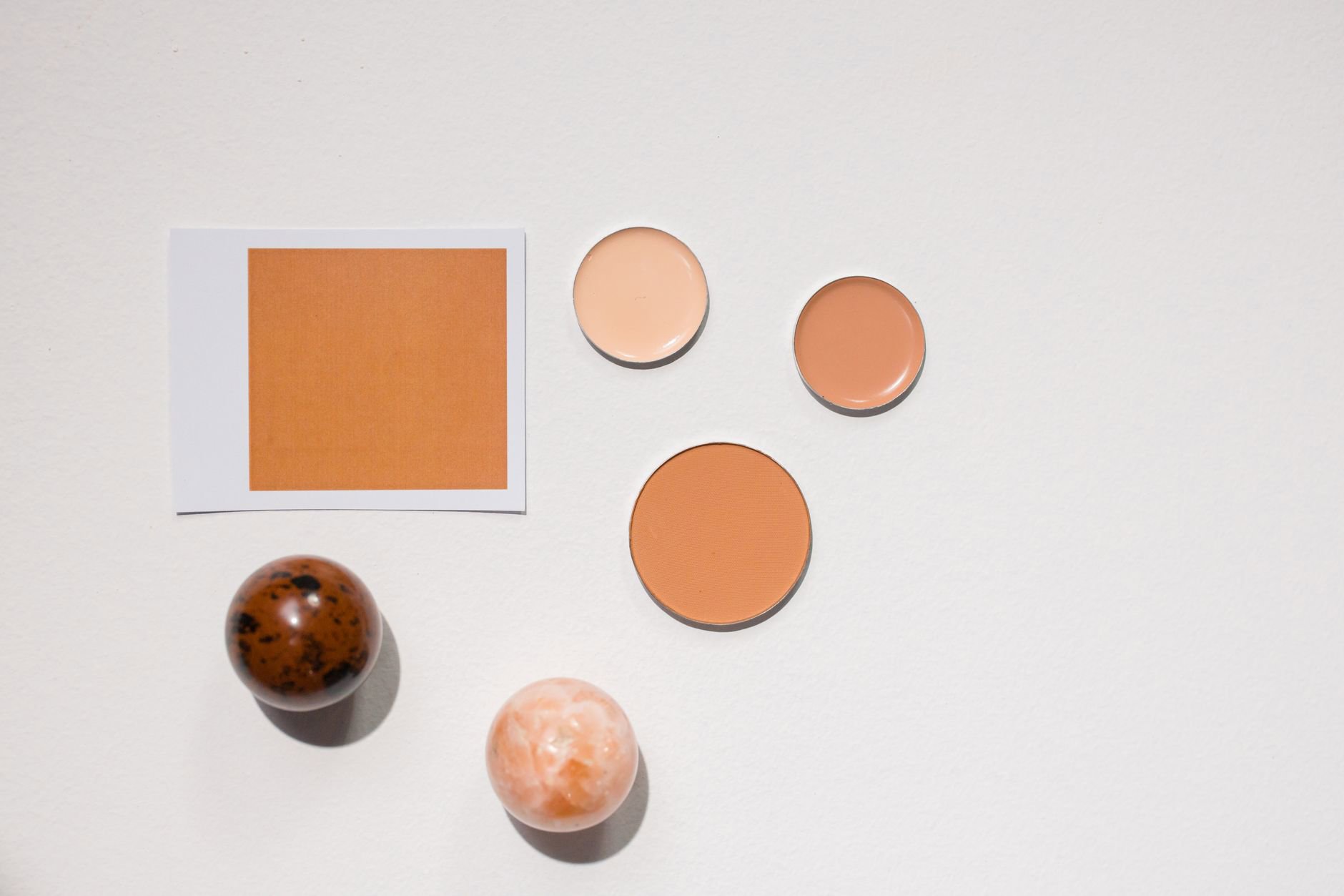 drugstore foundation bottles flatlay with shade swatches