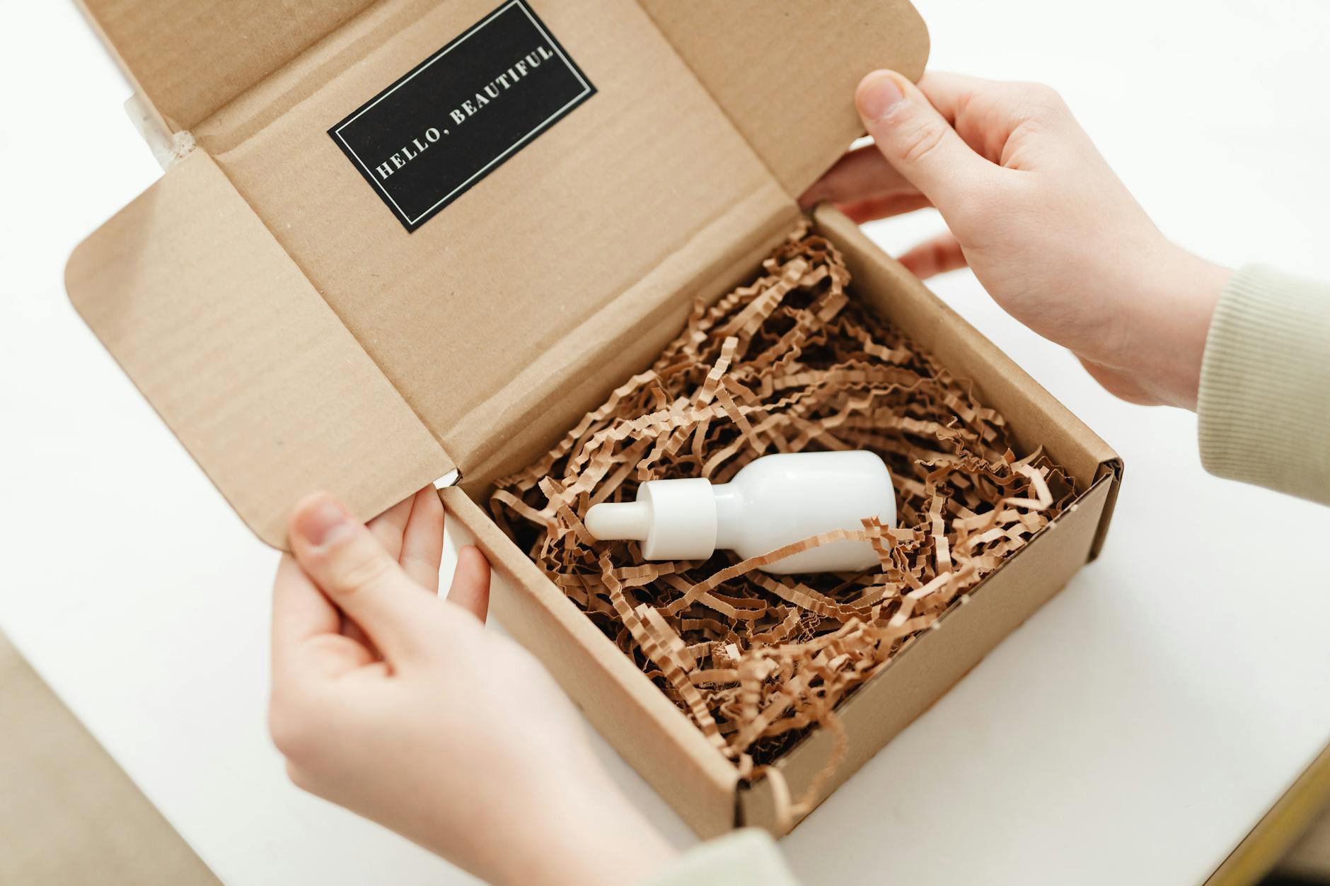 woman unboxing skincare package at home