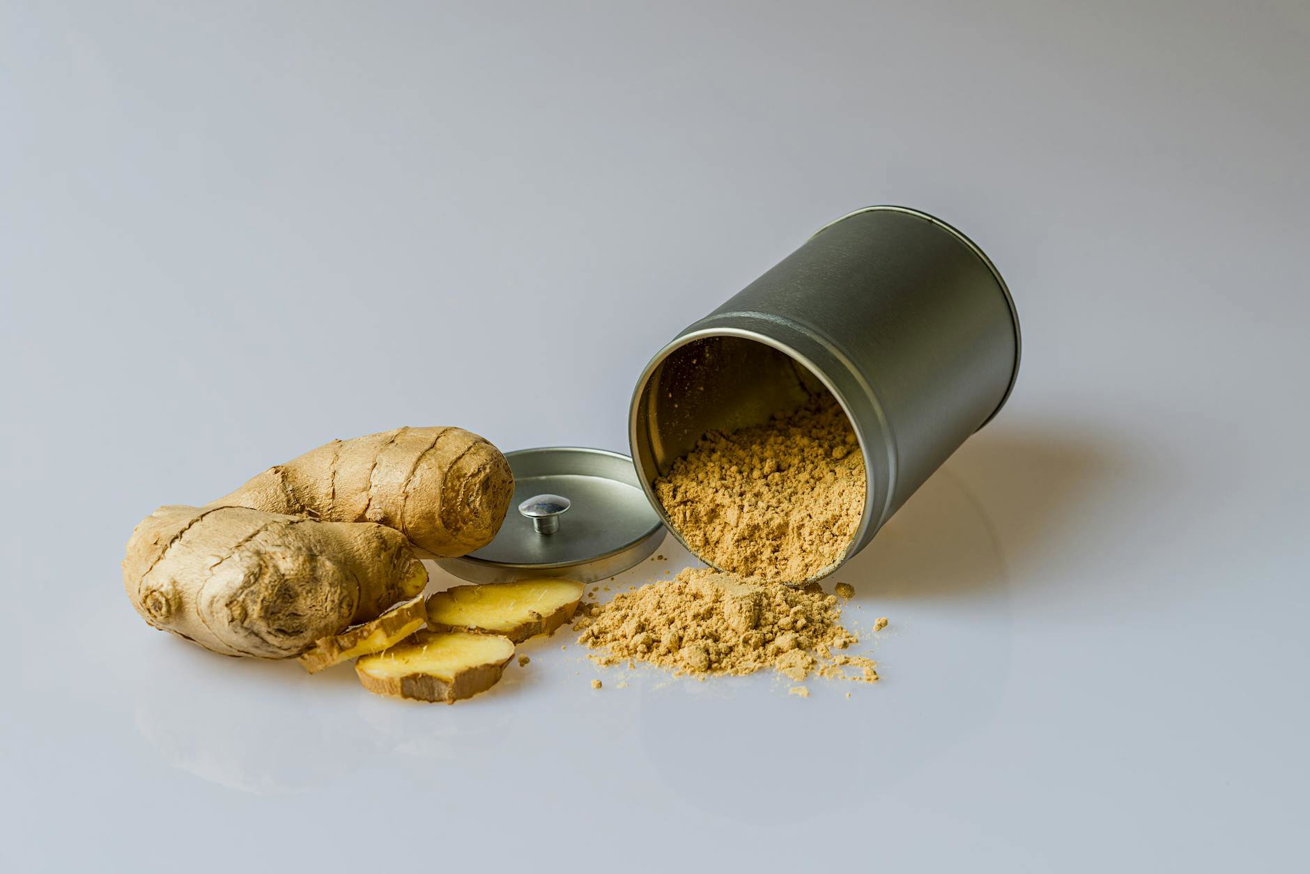 woman sprinkling hair powder at roots for volume