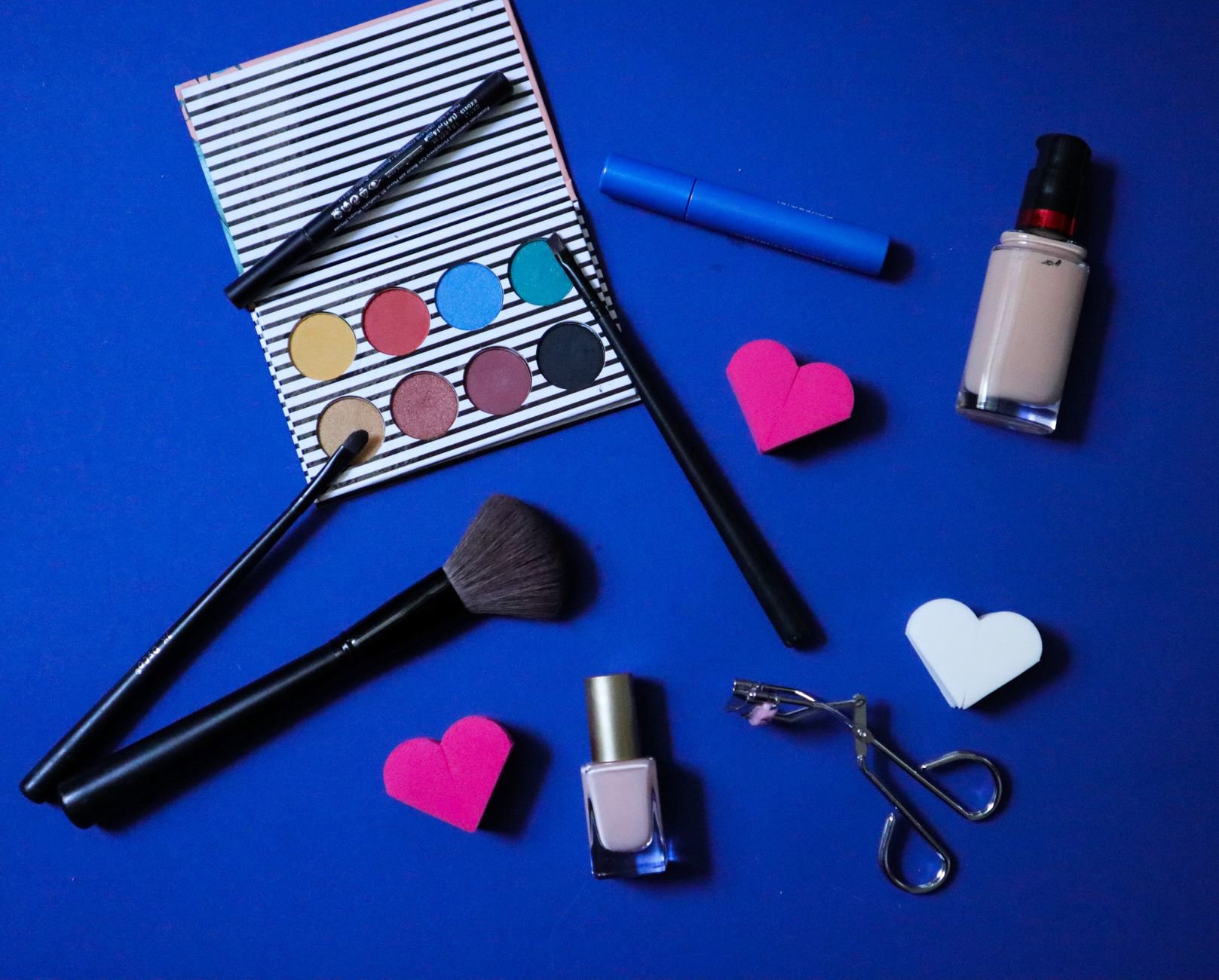 blue eyeshadow palette flatlay