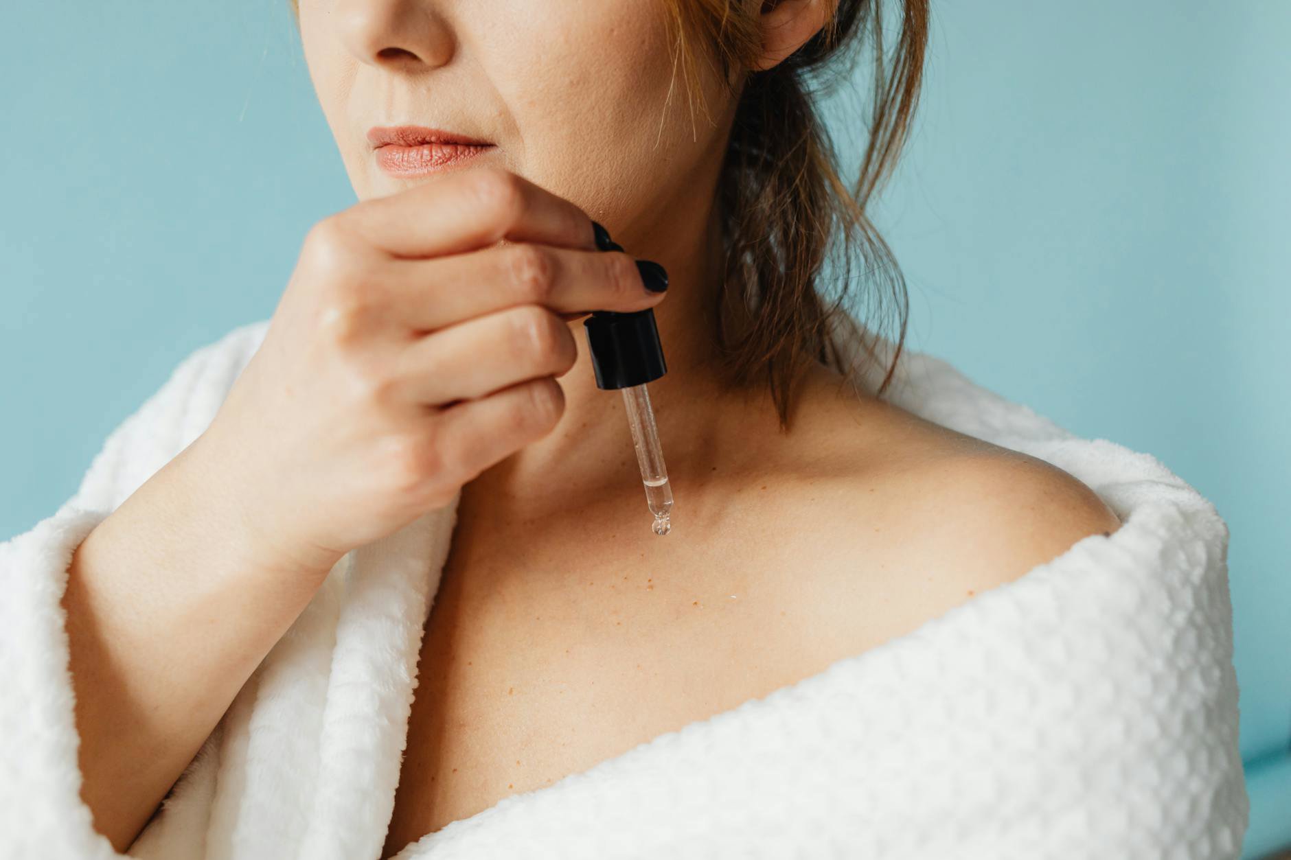 dropper face oil texture on skin macro