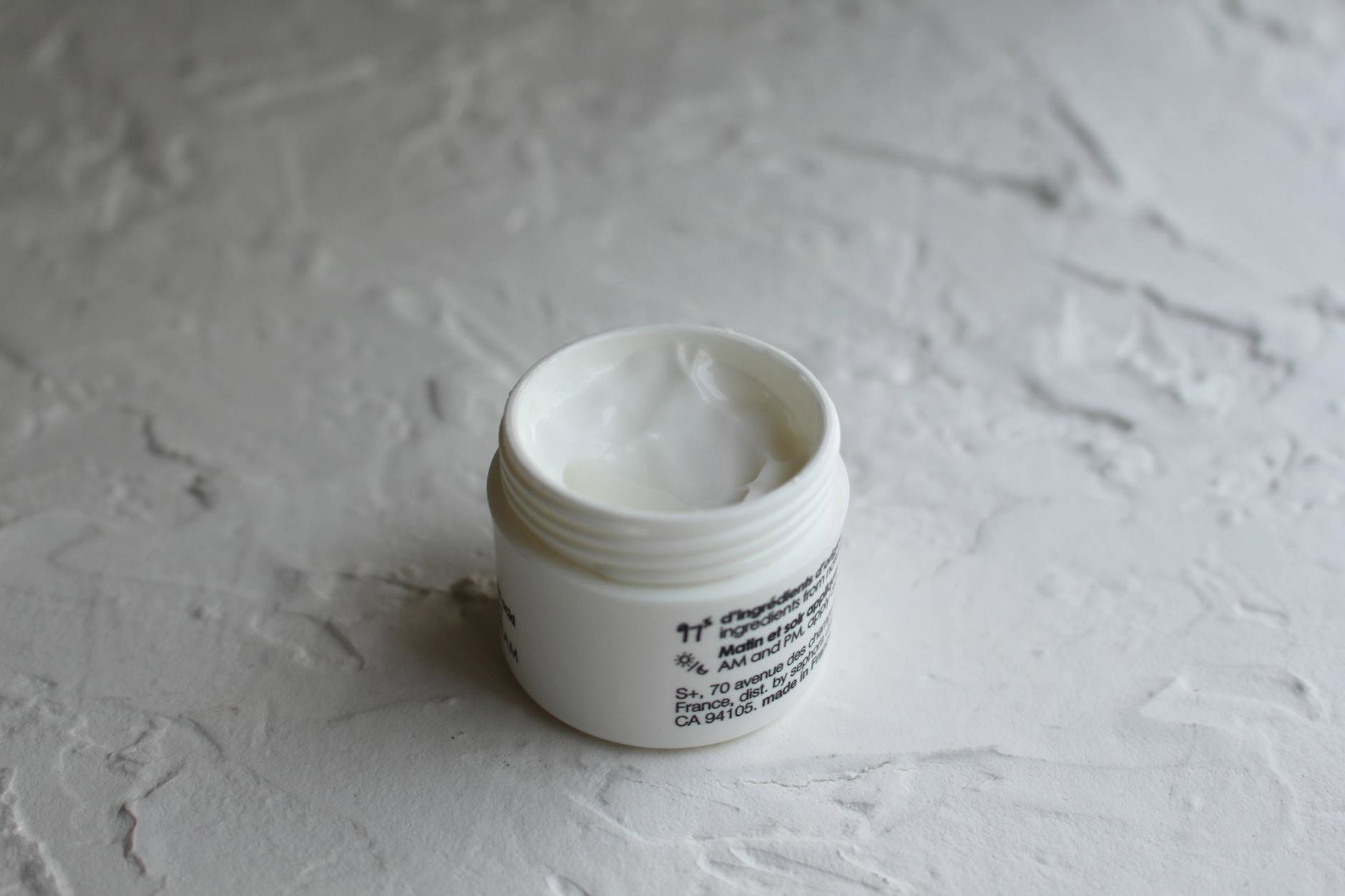 skincare jar open bathroom counter
