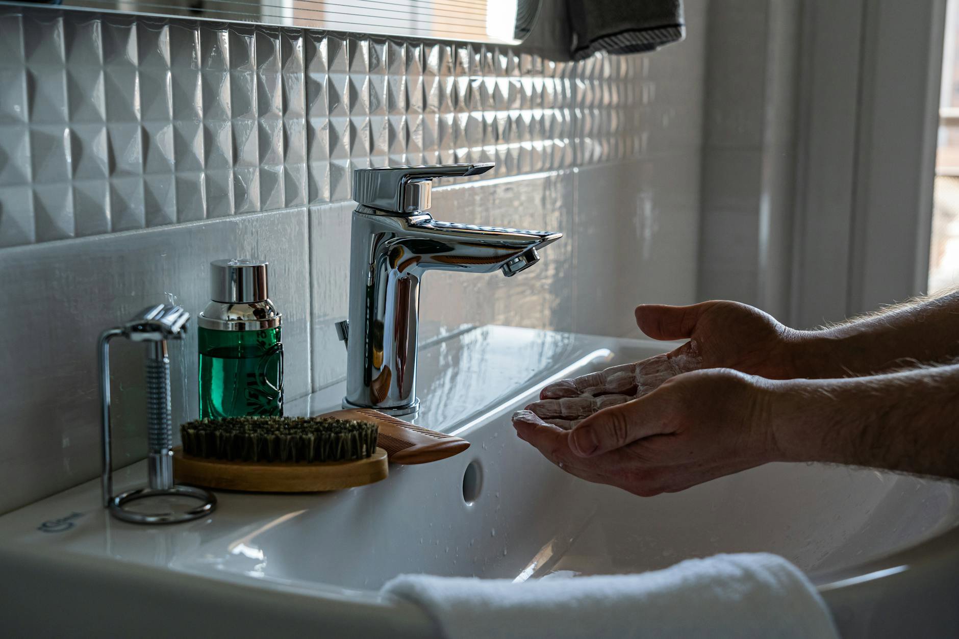 foaming cleanser lather hands bathroom sink