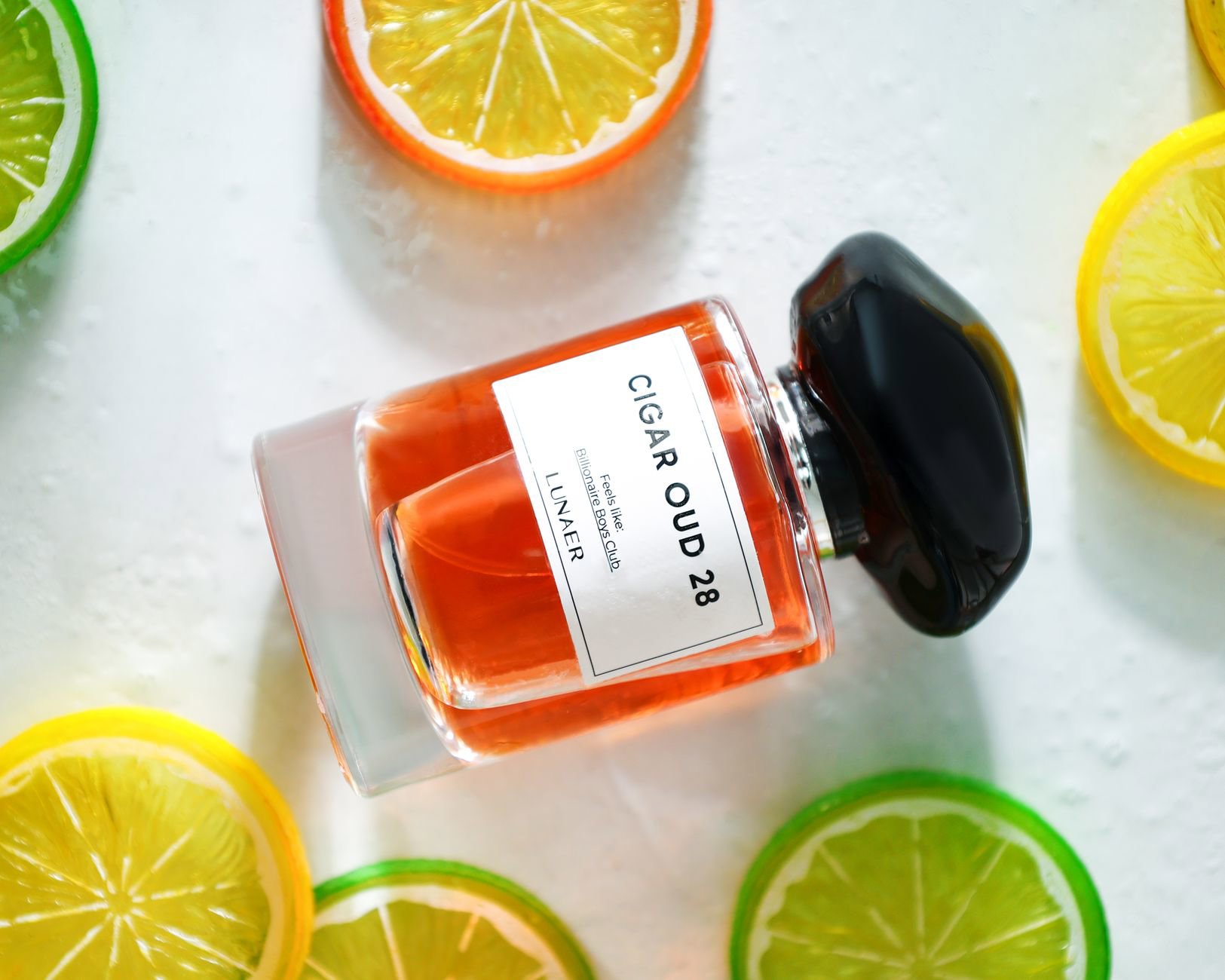 summer perfume bottles on vanity with citrus slices