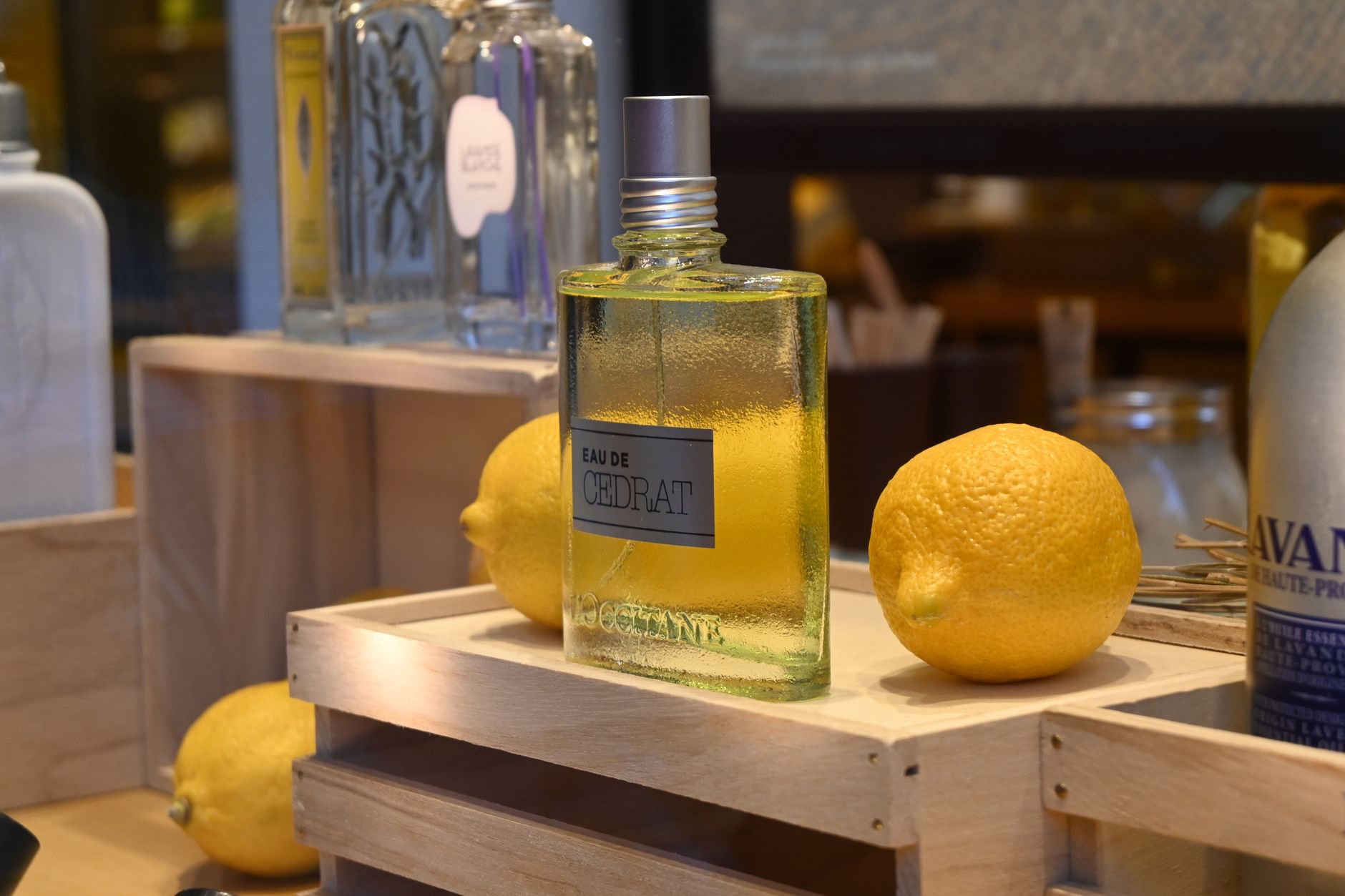 perfume bottle on summer vanity with citrus fruits