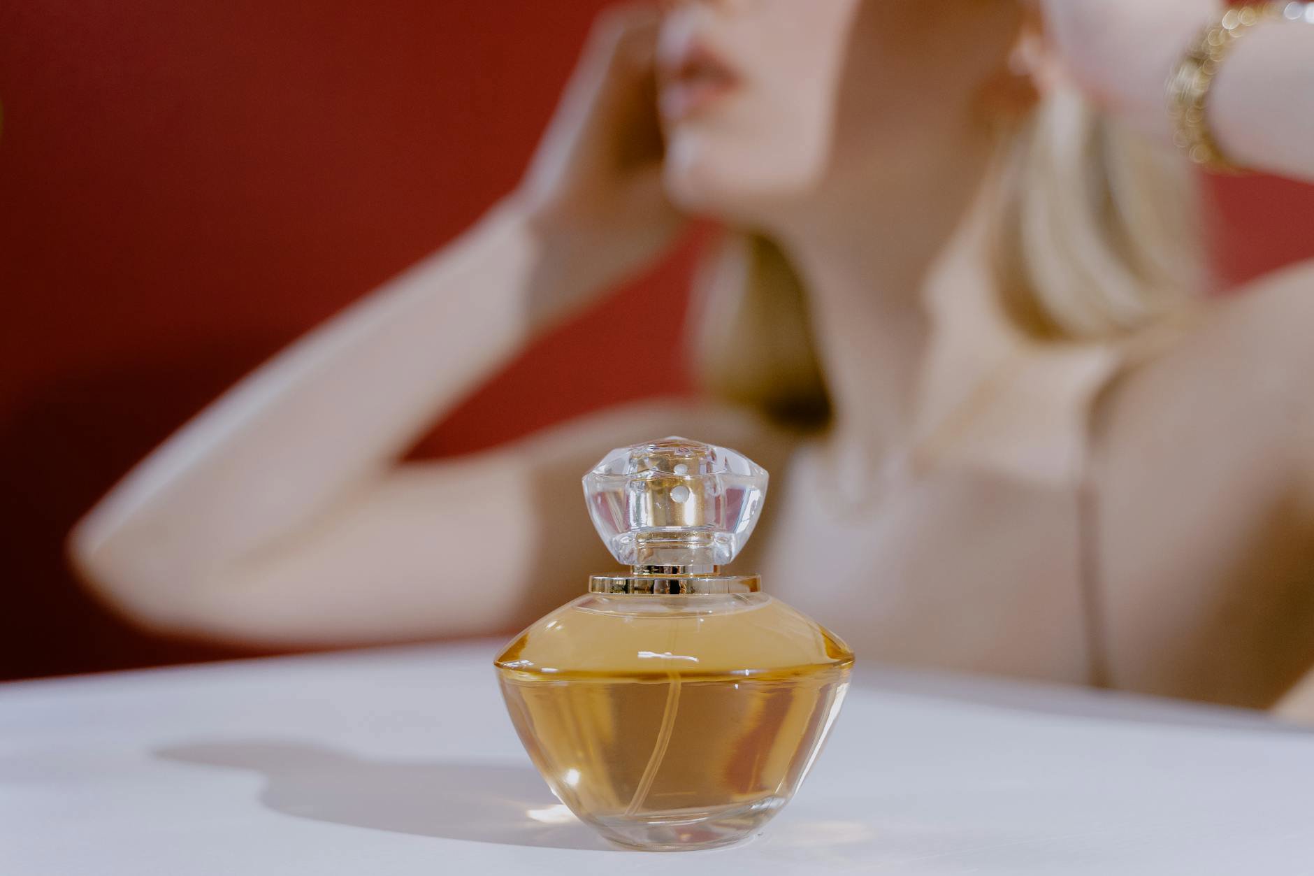 woman smelling perfume blotter niche fragrance boutique