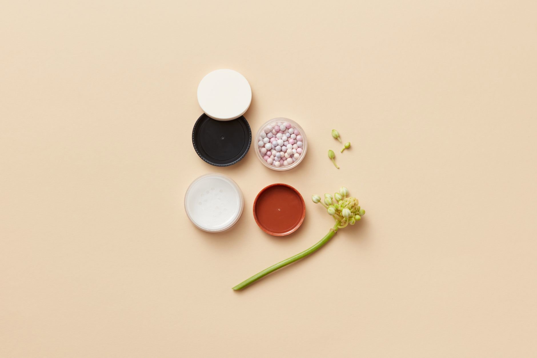makeup flatlay with ingredient labels close up