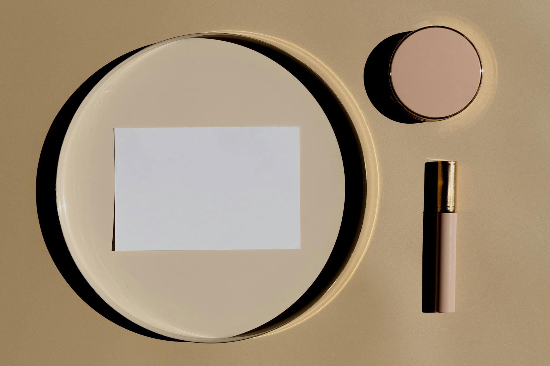flatlay luxury lipsticks neutral background