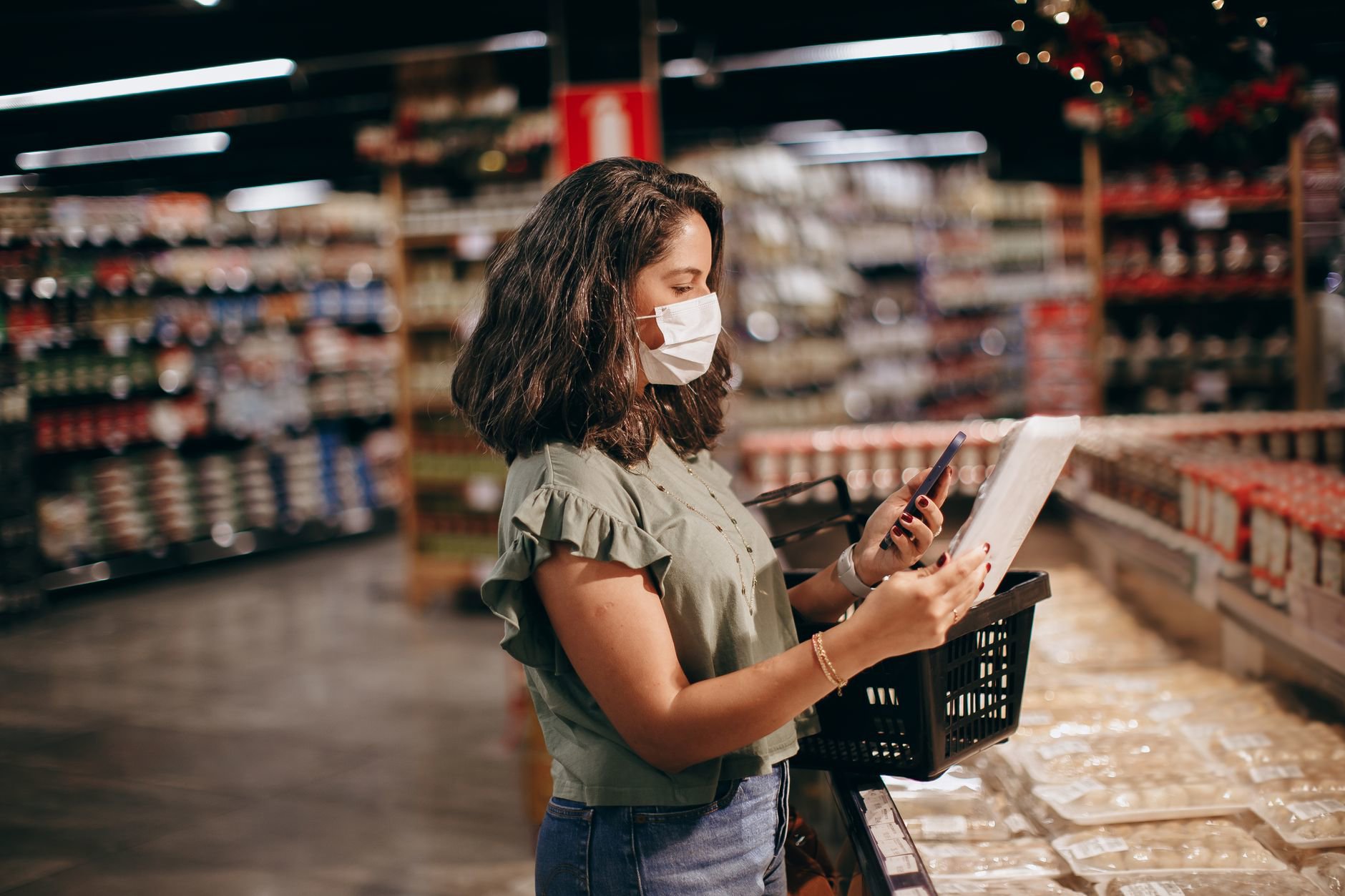 woman checking skincare prices on phone