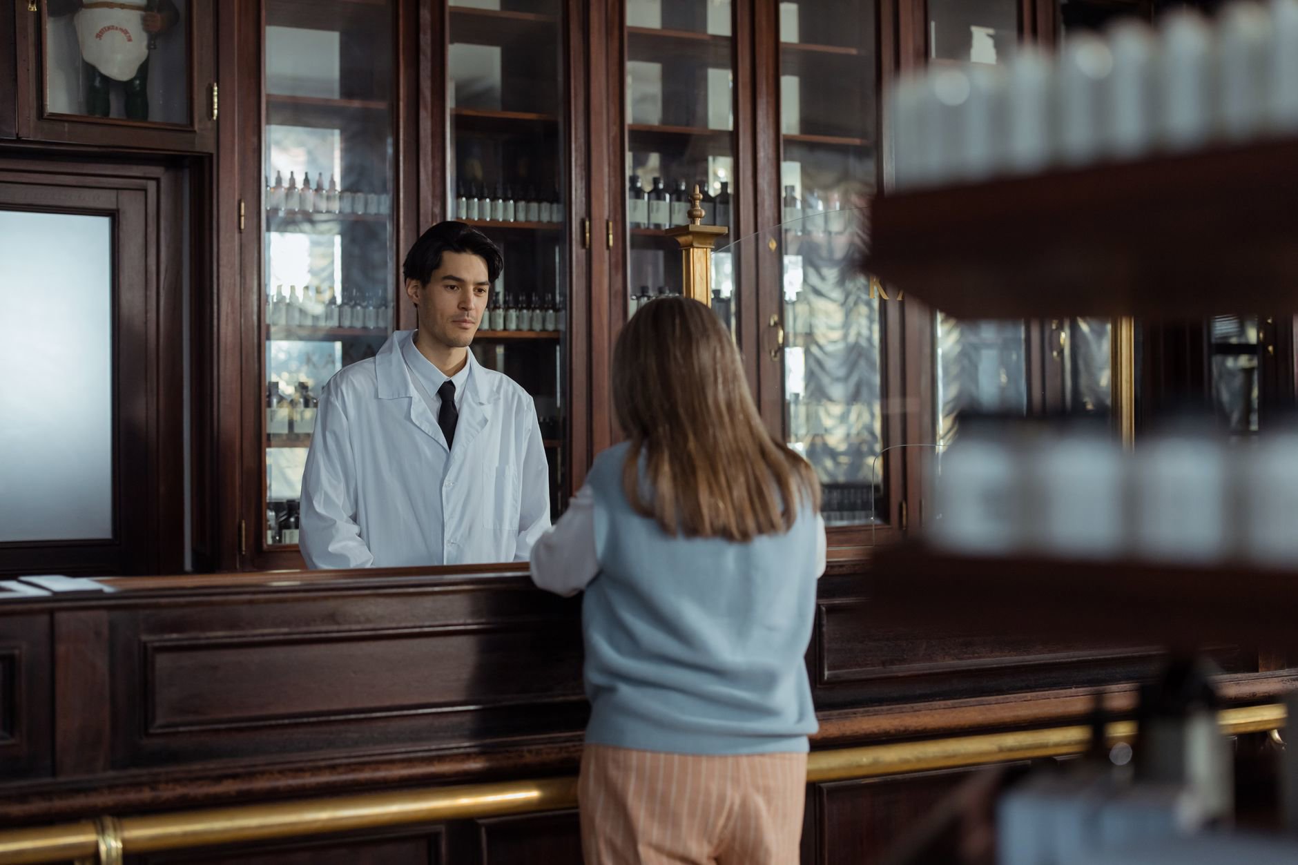 French pharmacy skincare counter woman consultation