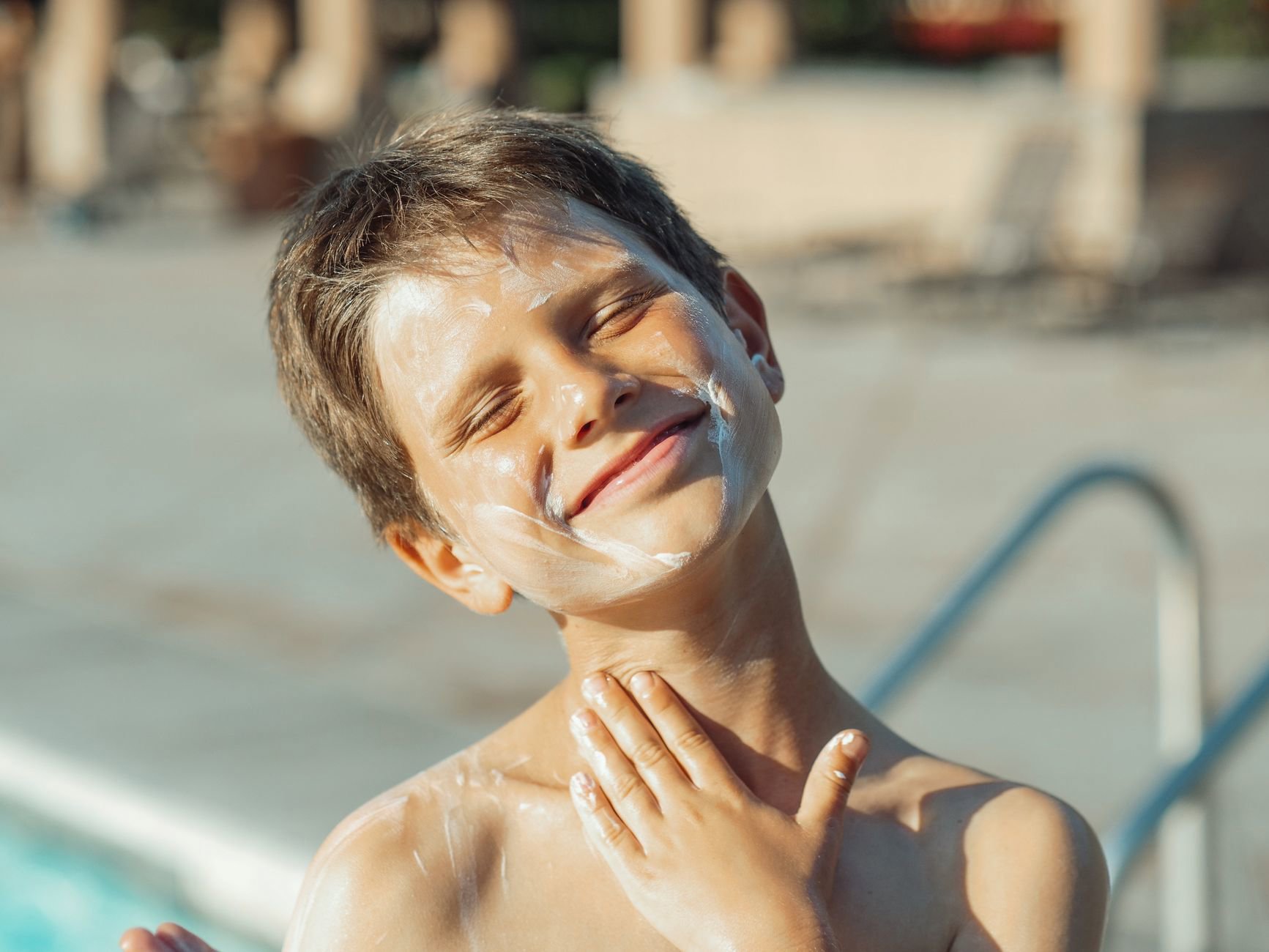 woman applying sunscreen face daytime