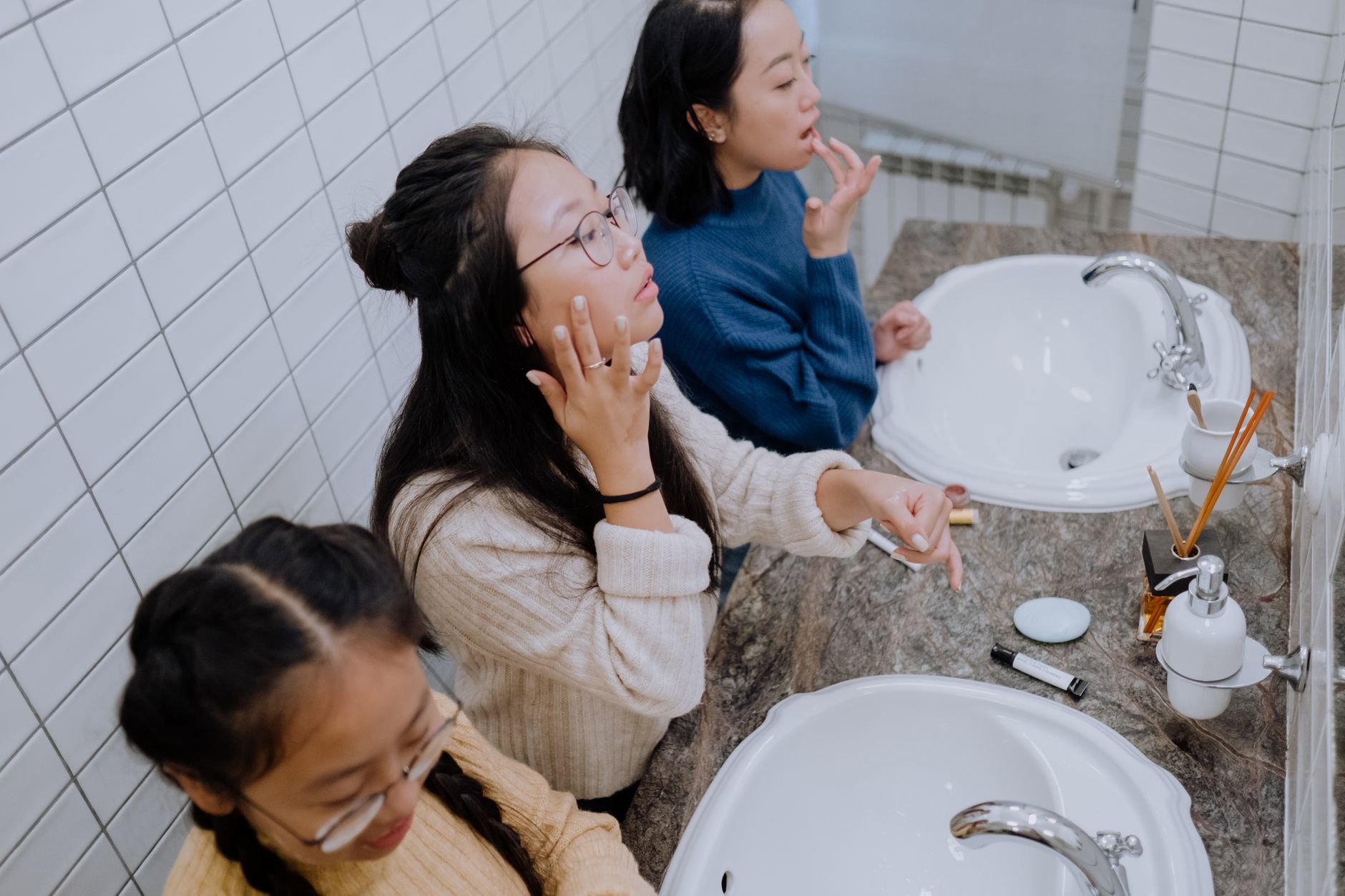 teen girl skincare products on bathroom counter australia