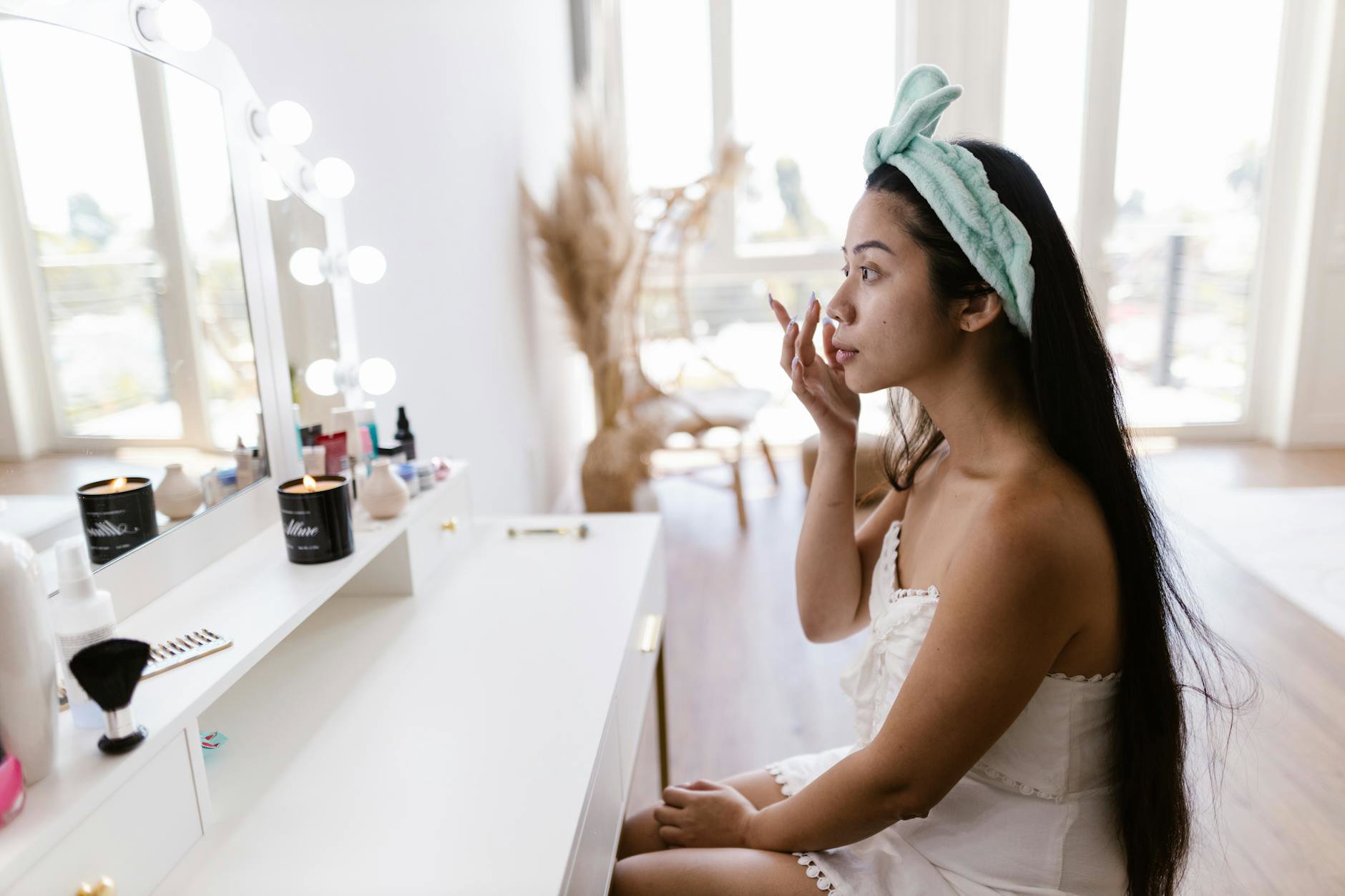 woman scrolling TikTok skincare at vanity