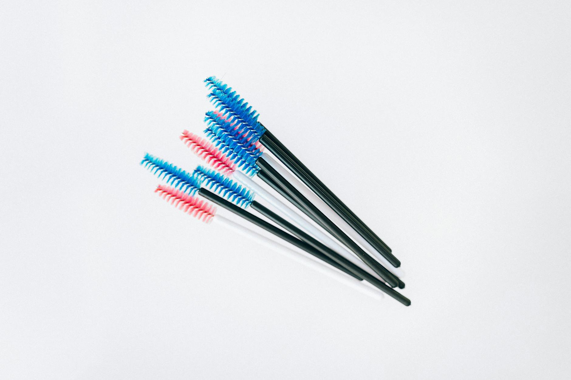 mascara wands flatlay on white background