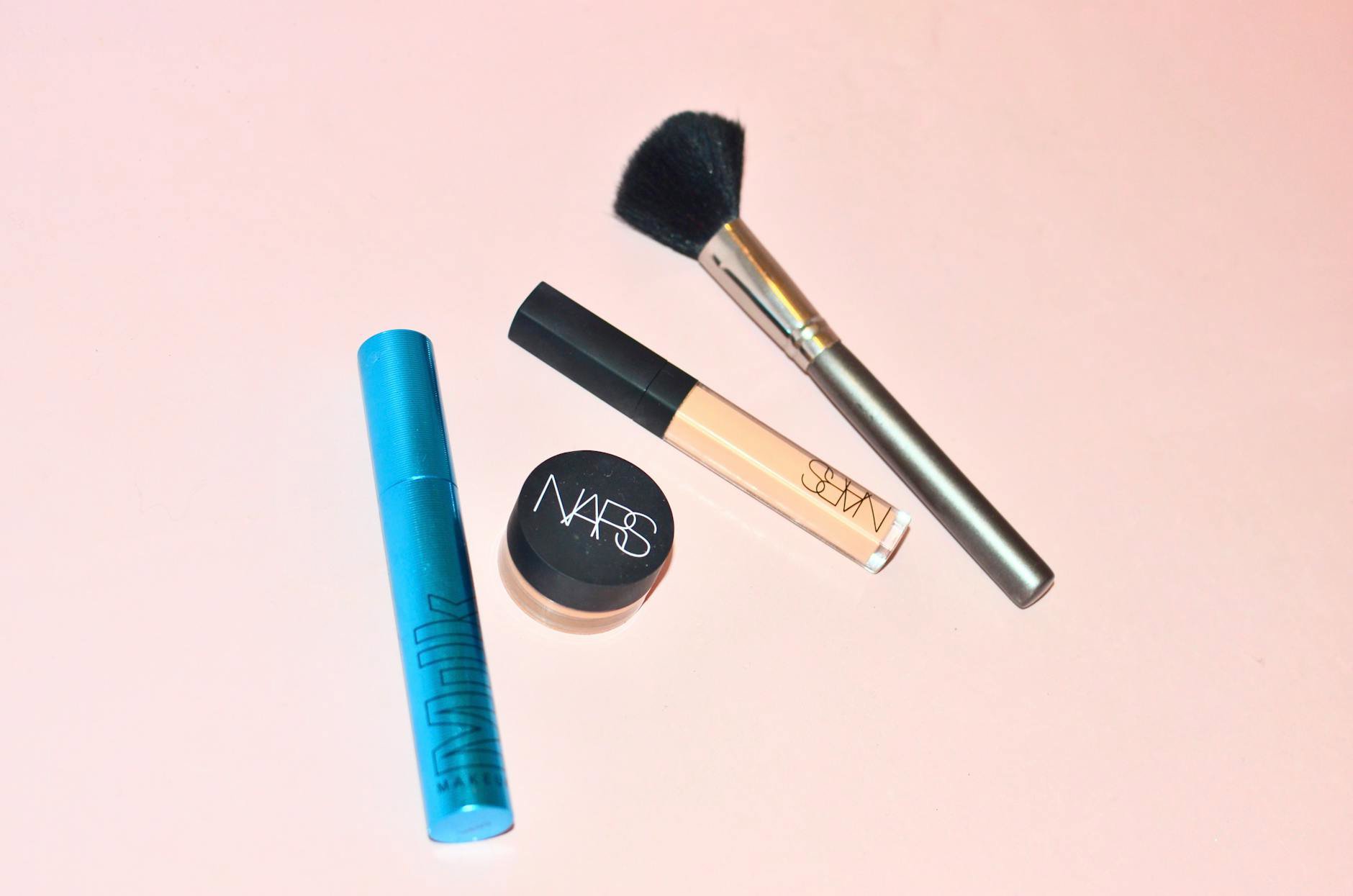 concealer tube and doe foot applicator white background