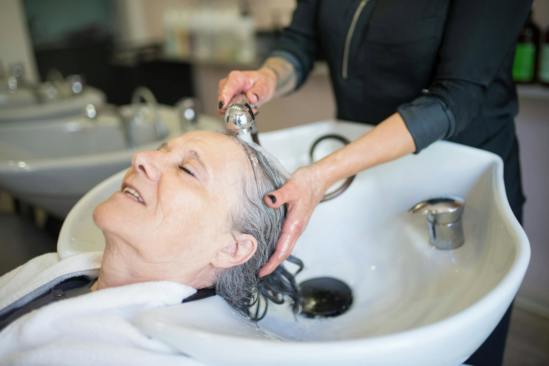 woman washing hair shower close up