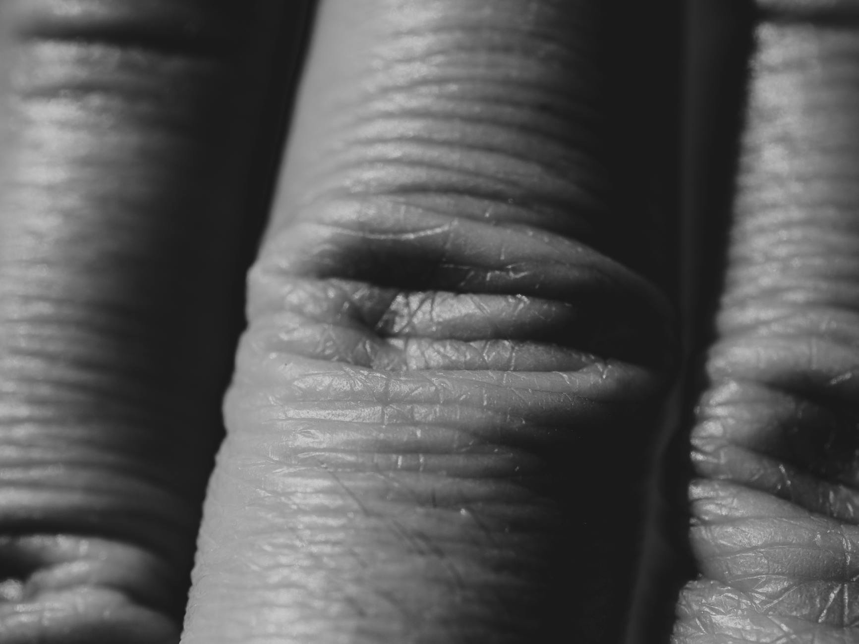 close up sunscreen texture on fingers